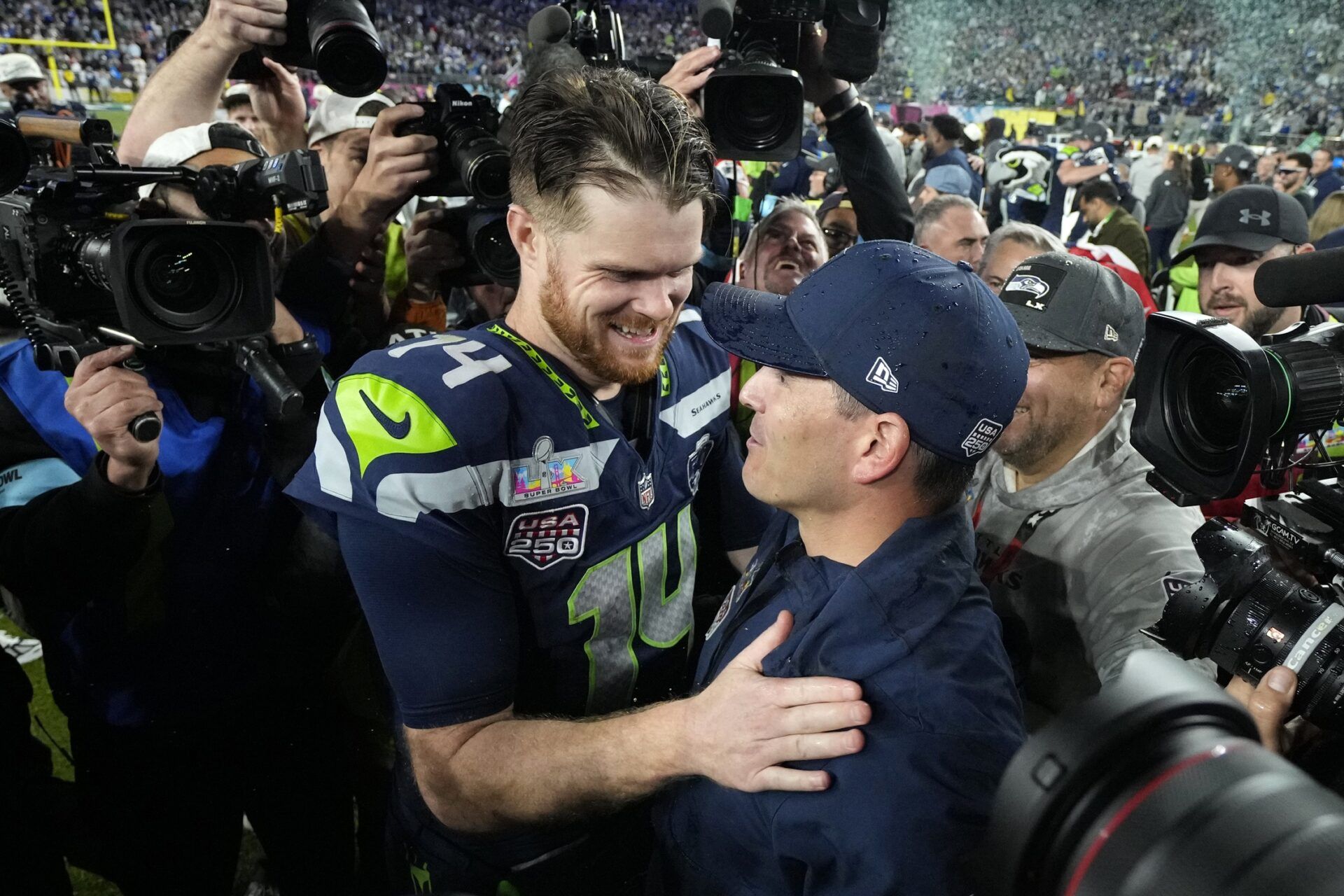 Seattle Seahawks head coach Mike MacDonald celebrates with quarterback Sam Darnold (14) after defeating the New England Patriots in Super Bowl LX at Levi's Stadium.