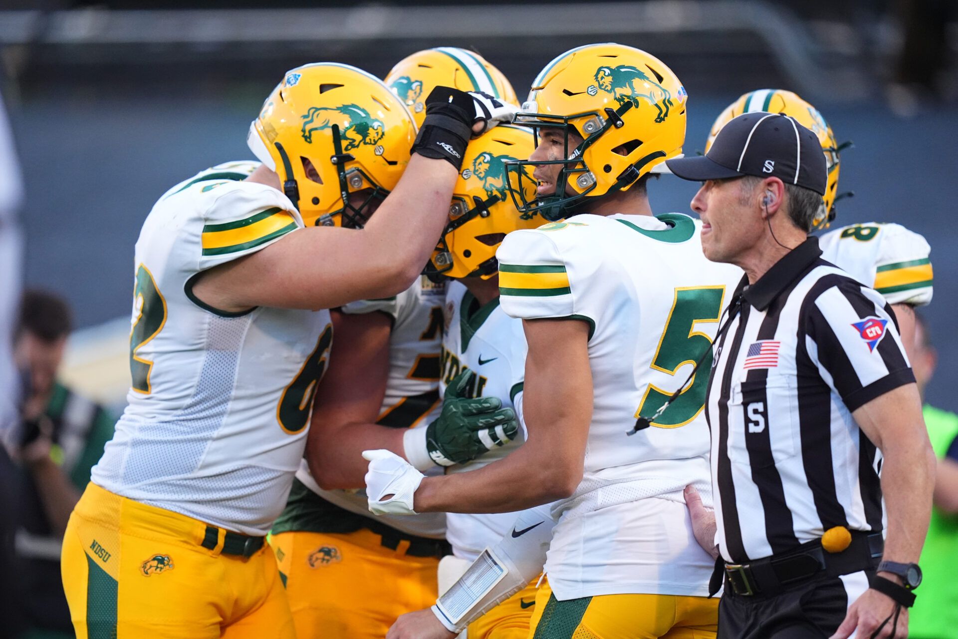 North Dakota State Bison quarterback Cam Miller (7) (center) celebrates his rushing touchdown in the second quarter against the Colorado Buffaloes at Folsom Field.