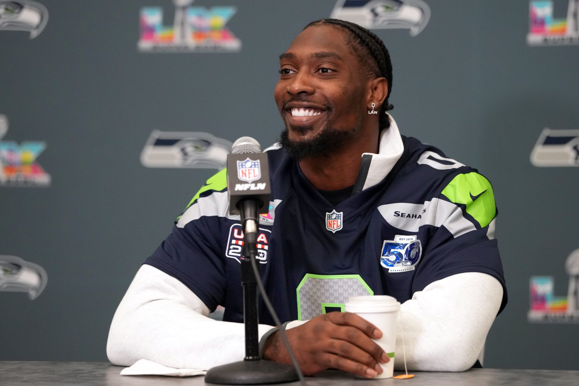 Seattle Seahawks defensive end DeMarcus Lawrence (0) talks to media members at the San Jose Marriott.