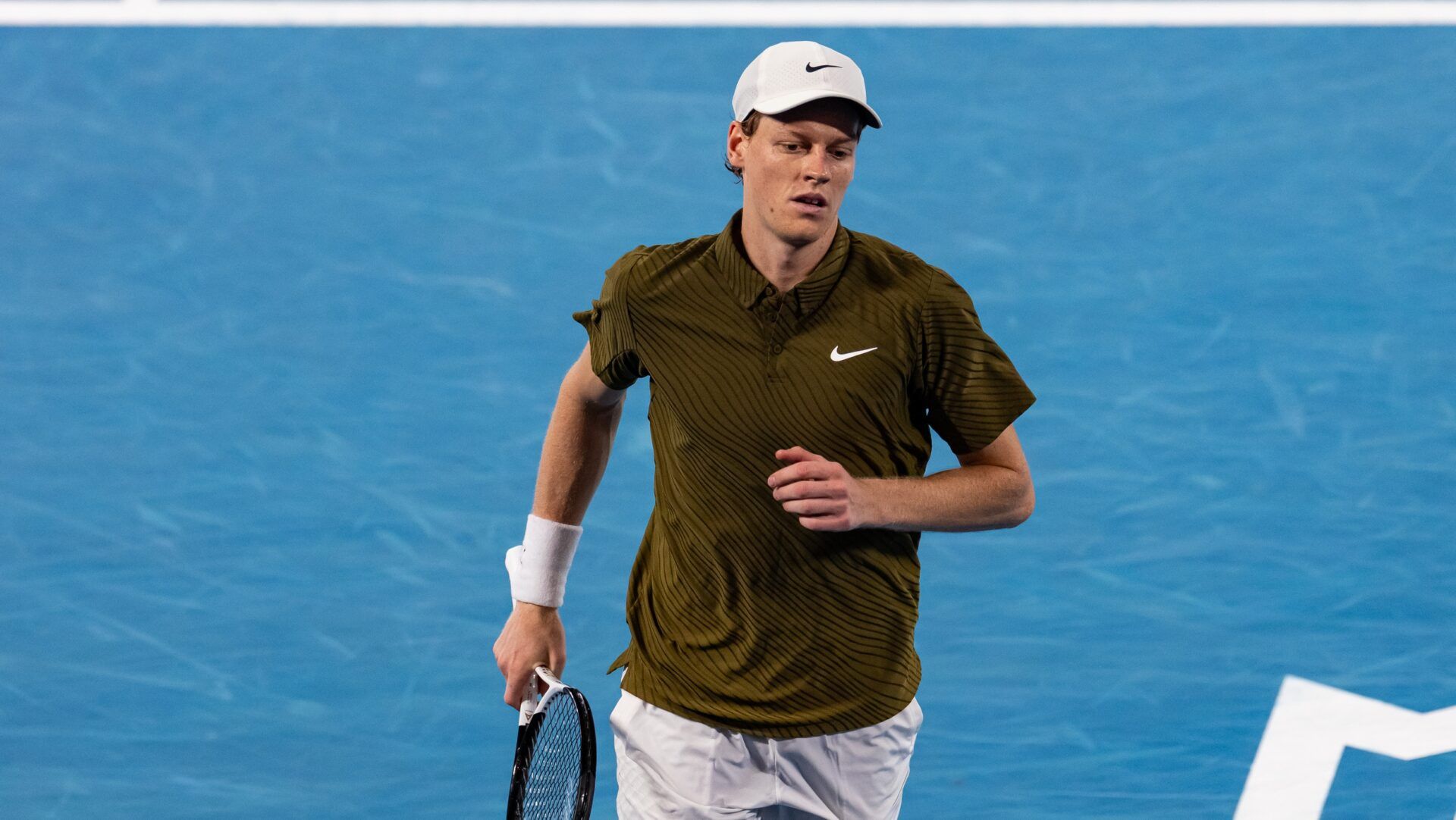 Jannik Sinner of Italy in action against Novak Djokovic of Serbia in the semifinals of the mens singles at the Australian Open at Rod Laver Arena in Melbourne Park.