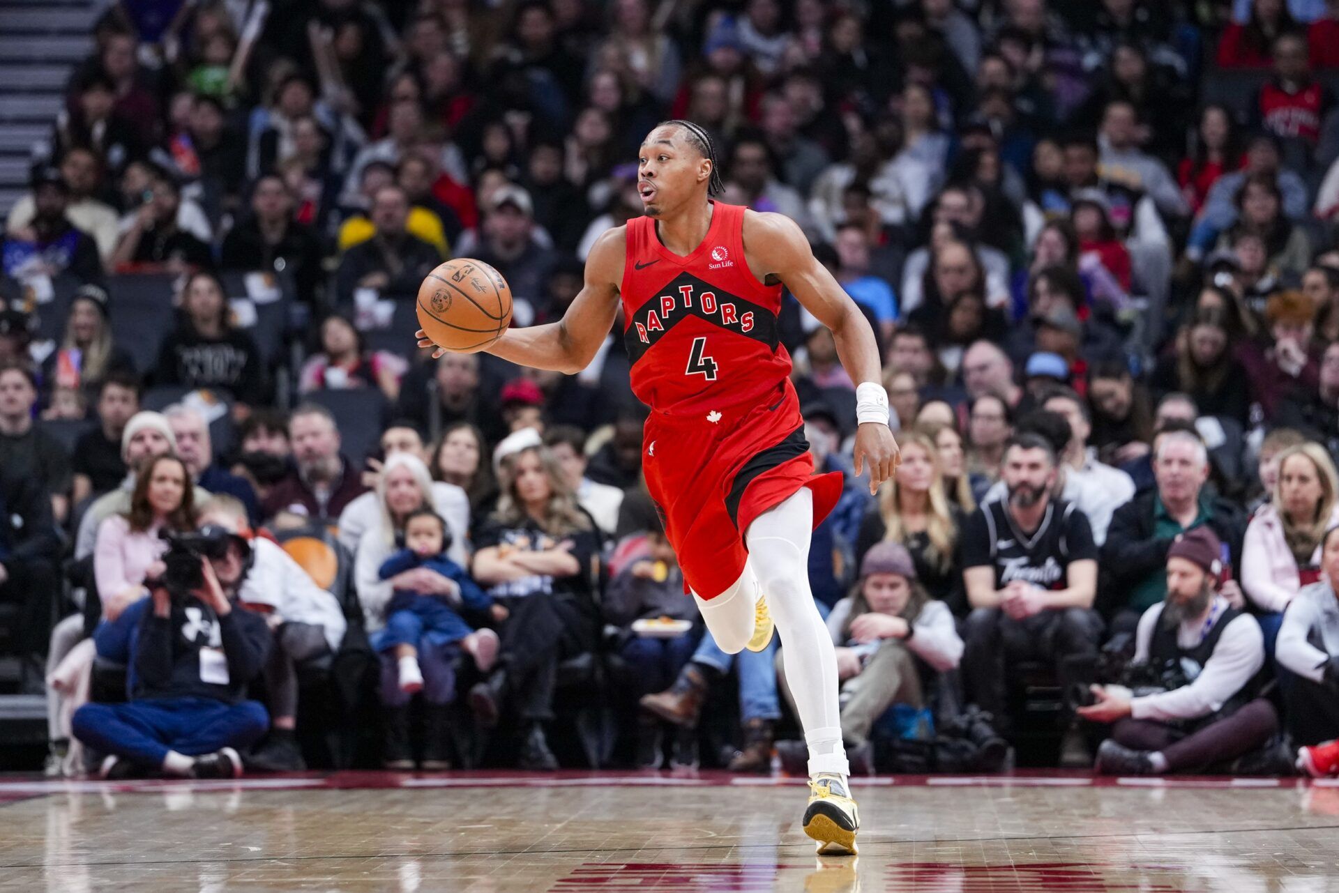 Toronto Raptors forward Scottie Barnes (4) dribbles downcourt against the Indiana Pacers during the first half at Scotiabank Arena.