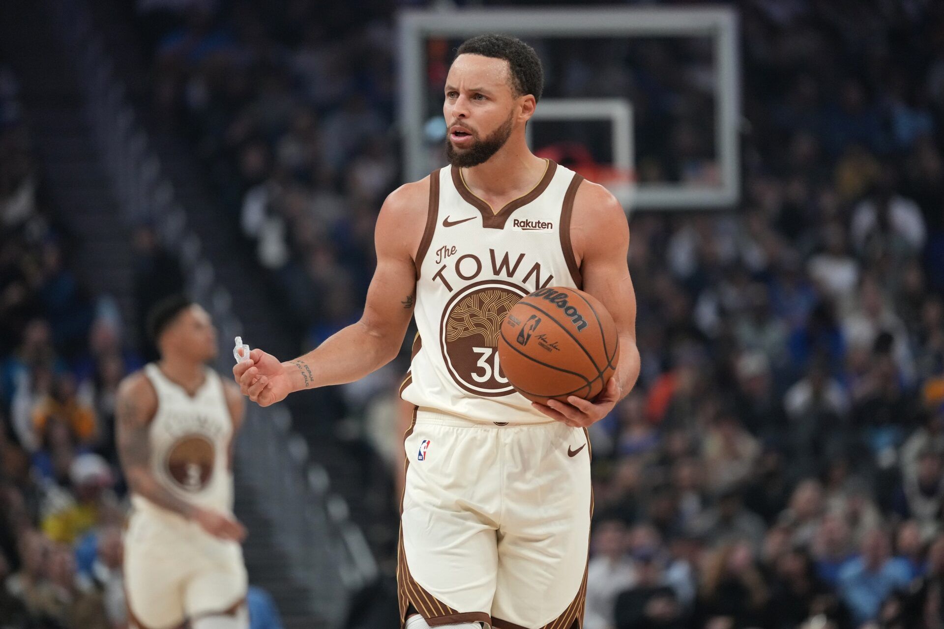 Golden State Warriors guard Stephen Curry (30) reacts after committing a turnover against the Detroit Pistons in the first quarter at the Chase Center.