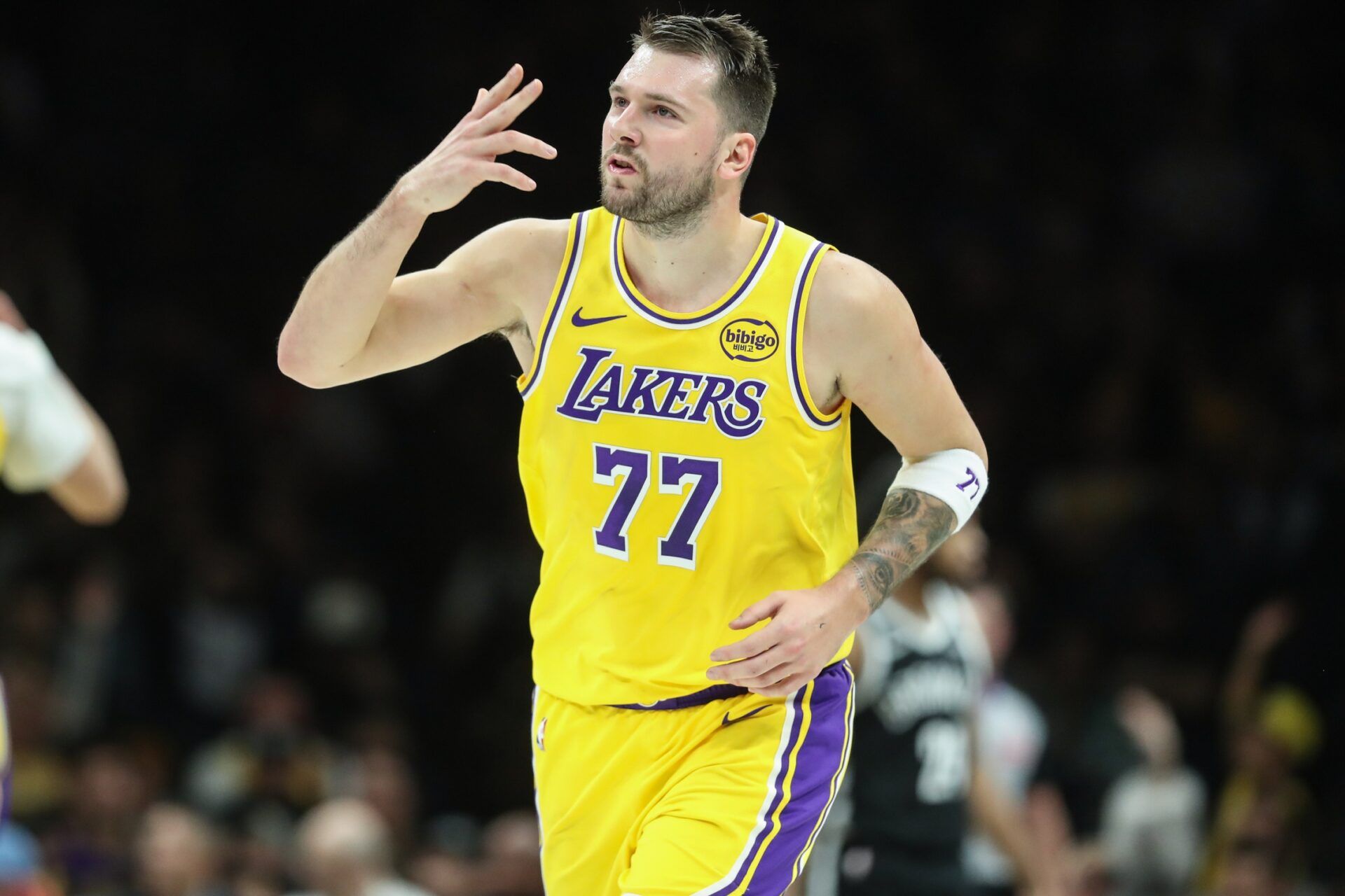 Los Angeles Lakers guard Luka Doncic (77) gestures after scoring in the first quarter against the Brooklyn Nets at Barclays Center.