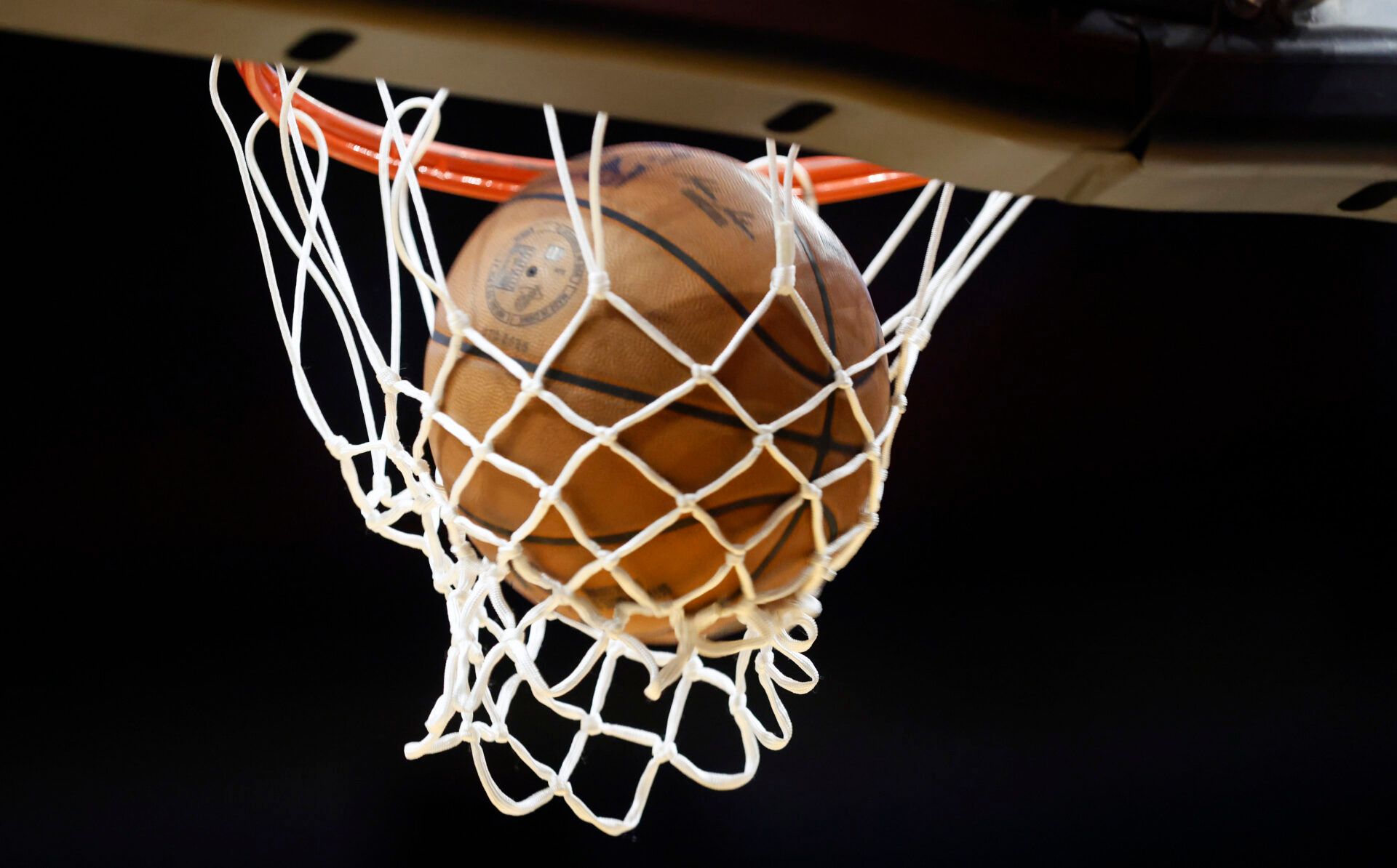 A basketball goes through the hoop during warm ups between the Atlanta Hawks against the Miami Heat at Kaseya Center.
