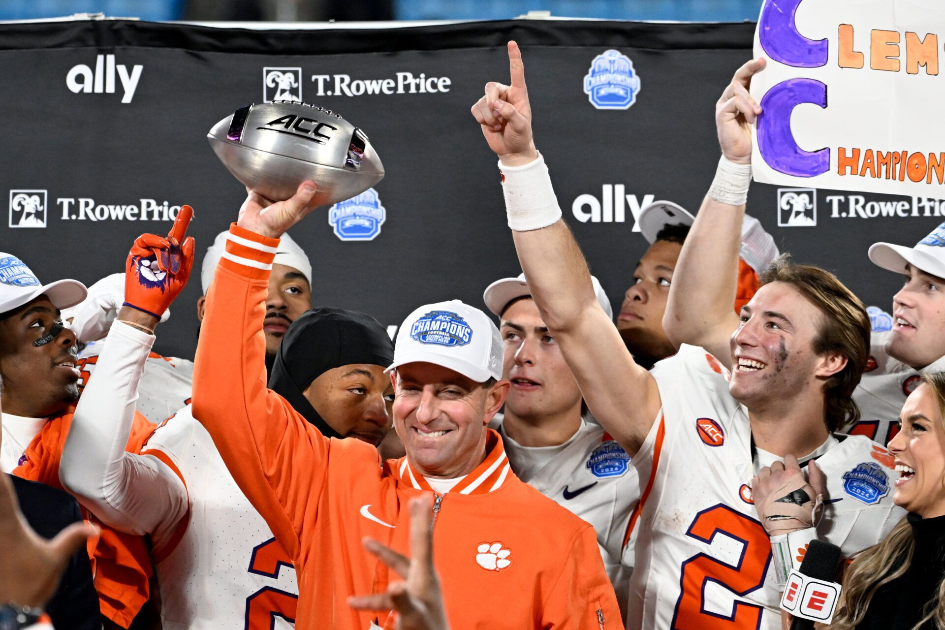 Clemson Tigers head coach Dabo Swinney, quarterback Cade Klubnik (2) and teammates celebrate after winning the 2024 ACC Championship game against the Southern Methodist Mustangs at Bank of America Stadium.