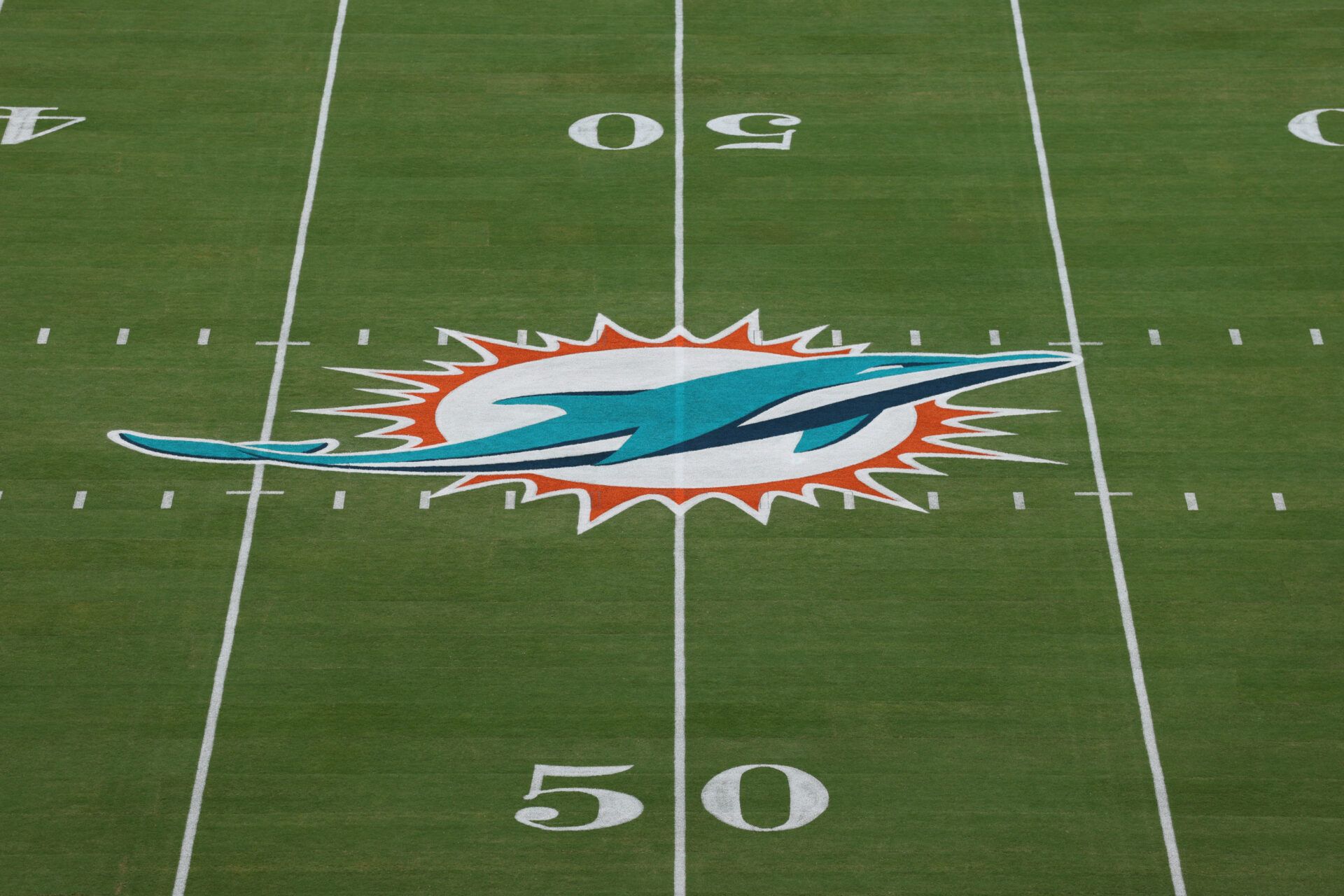 The Miami Dolphins logo is seen at midfield prior to a game against the Baltimore Ravens 
at Hard Rock Stadium.