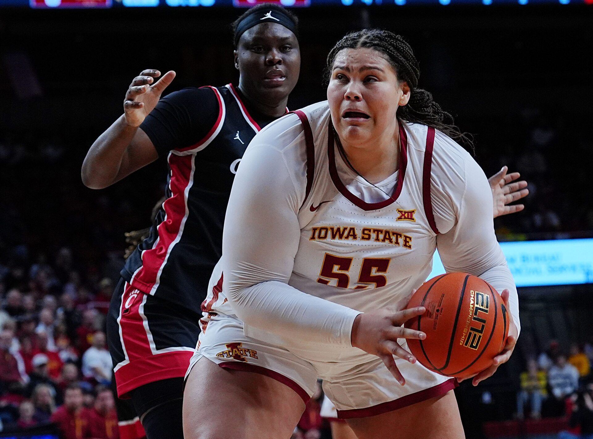 Iowa State Cyclones' center Audi Crooks (55) looks for a shot around Cincinnati Bearcats forward Alliance Ndiba (25) during the first quarter in the Big-12 women’s basketball on Jan. 21, 2026, at Hilton Coliseum in Ames, Iowa.