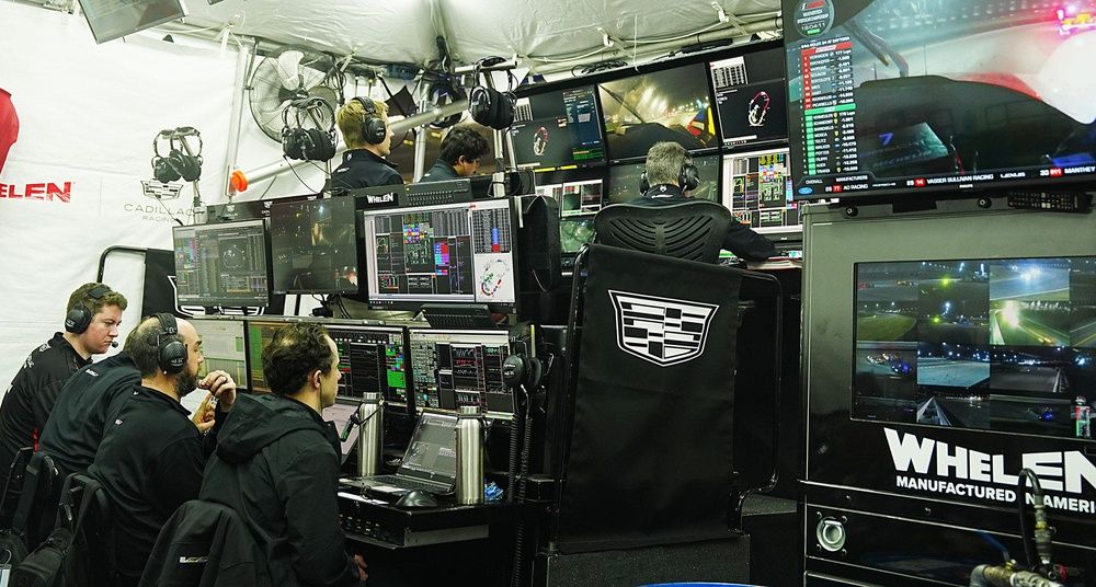 Crew members for the No. 31 Whelen Cadillac watch the screen during the Rolex 24, Saturday, Jan 24, 2026 at Daytona International Speedway.