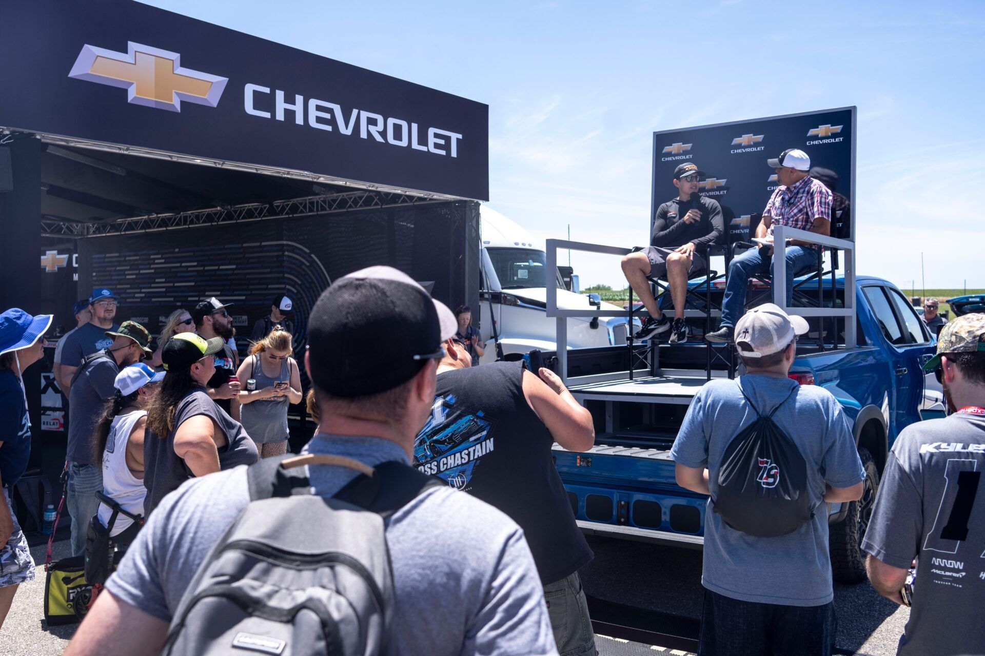 NASCAR Xfinity Series driver Sammy Smith speaks at the Chevrolet tent at NASCAR Summer Race Weekend on Friday, June 14, 2024, in Newton.