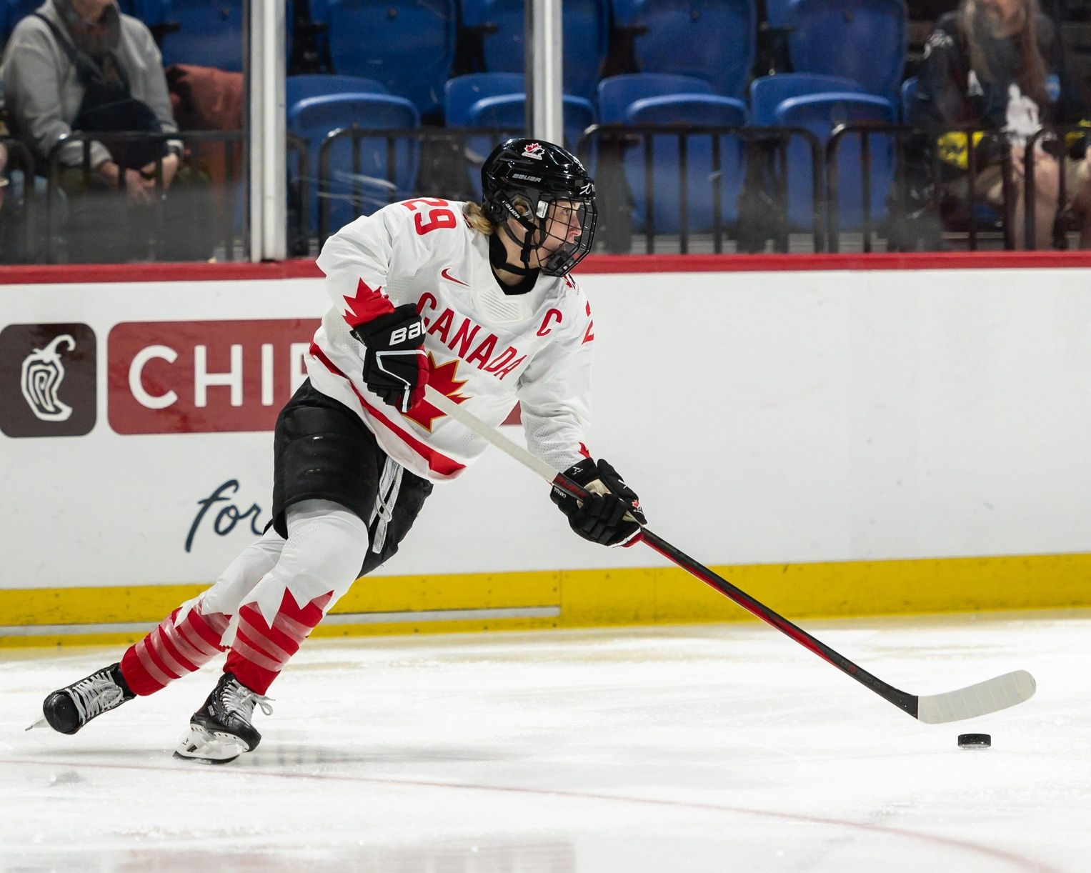 Canada's Marie-Philip Poulin looks for a pass at the Adirondack Bank Center in Utica, N.Y. on April 5, 2024.