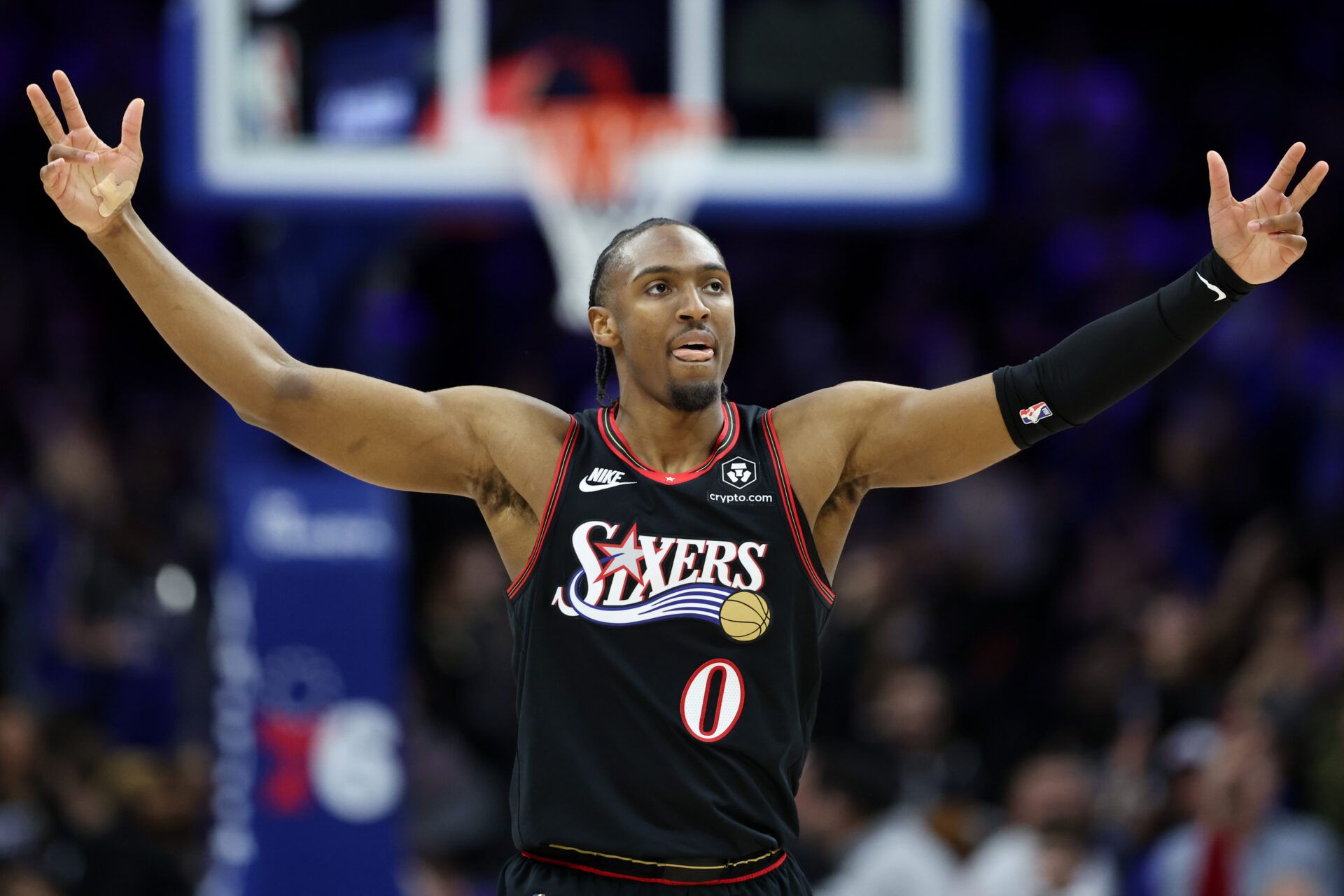 Philadelphia 76ers guard Tyrese Maxey (0) reacts to his teams three pointer against the New Orleans Pelicans during the fourth quarter at Xfinity Mobile Arena.