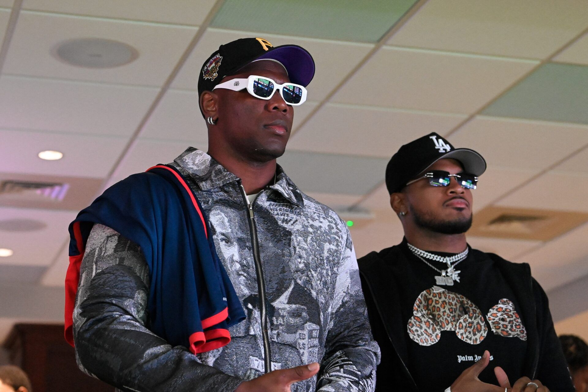 NFL player Keion White (L) looks on in the first half between the New England Revolution and Inter Miami CF at Gillette Stadium.