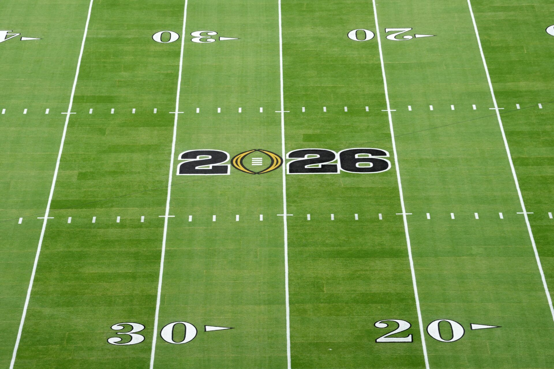 The 2026 Championship college football game logo on the field at Hard Rock Stadium.