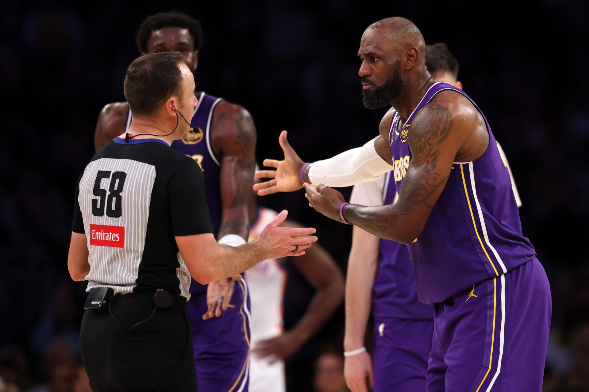 Los Angeles Lakers forward LeBron James (23) argues with referee Josh Tiven (58) during the fourth quarter against the Oklahoma City Thunder at Crypto.com Arena.