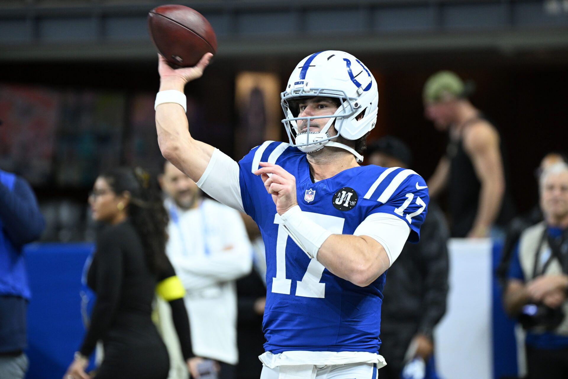 Indianapolis Colts quarterback Daniel Jones (17) warms up before a game against the Houston Texans at Lucas Oil Stadium.