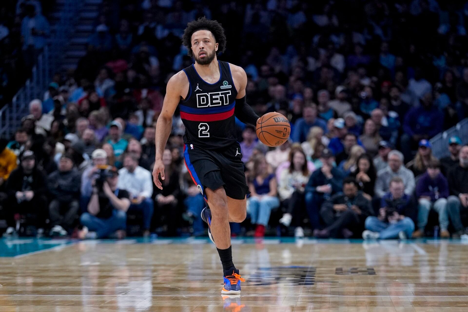 Detroit Pistons guard Cade Cunningham (2) brings the ball up court during the second half against the Charlotte Hornets at Spectrum Center.