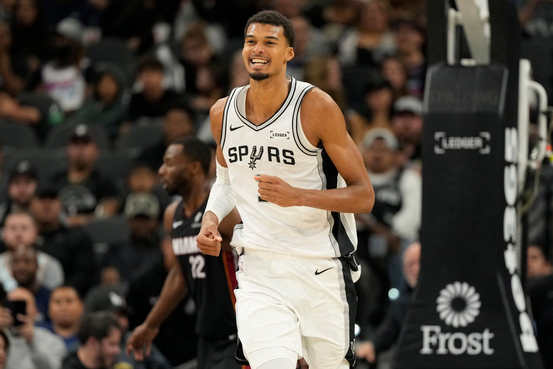 San Antonio Spurs forward Victor Wembanyama (1) reacts after losing the ball out of bounds during the second half against the Miami Heat at Frost Bank Center.