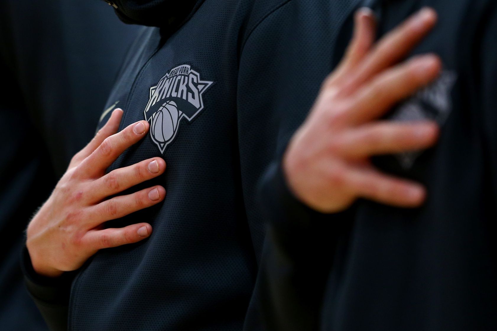 A view of the Knicks logo on a players jacket during the national anthem prior to the game against the Detroit Pistons at Little Caesars Arena.
