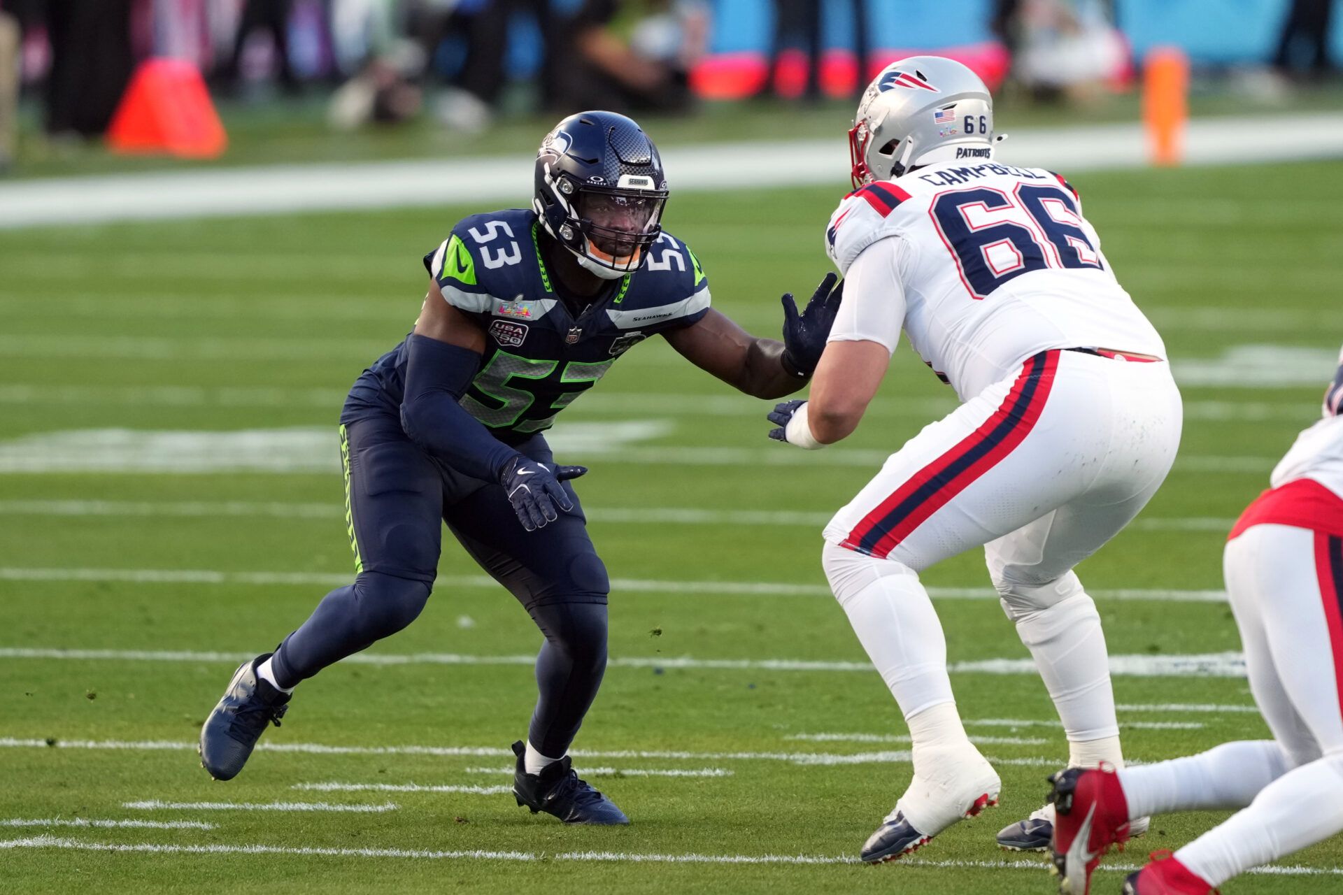 Seattle Seahawks linebacker Boye Mafe (53) rushes against New England Patriots offensive tackle Will Campbell (66) during the second quarter in Super Bowl LX at Levi's Stadium.