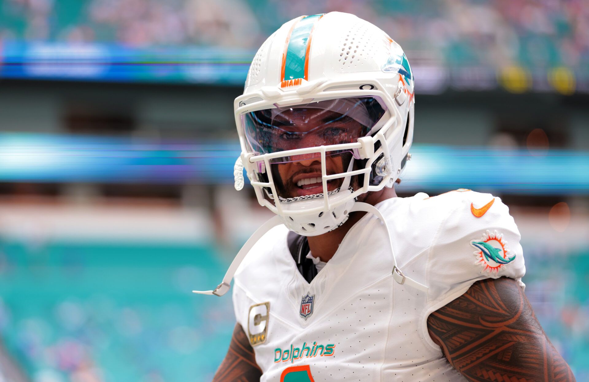 Miami Dolphins quarterback Tua Tagovailoa (1) warms up before a game against the Buffalo Bills at Hard Rock Stadium.