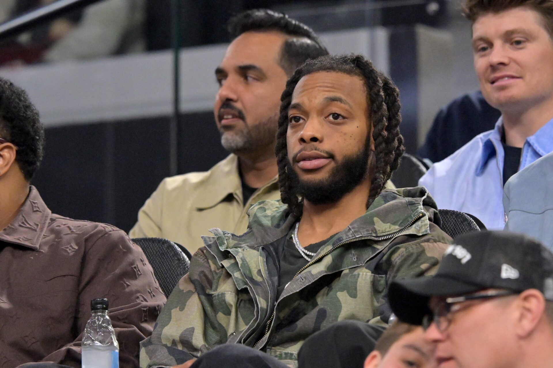 Los Angeles Clippers Darius Garland sits in the stands as he watches the game against the Cleveland Cavaliers in the first half at Intuit Dome.