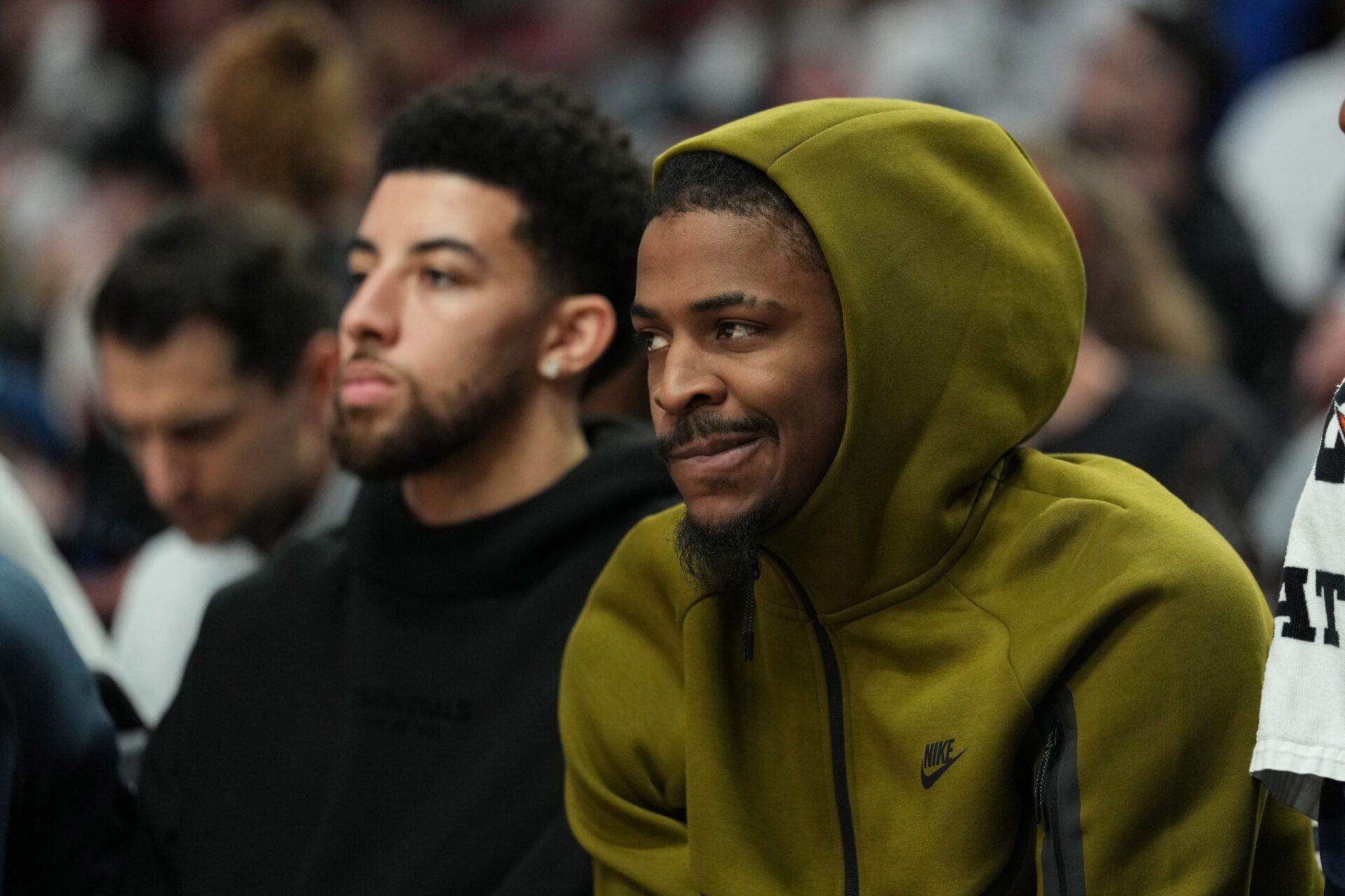 Memphis Grizzlies guards Scotty Pippen Jr. (1, left) and Ja Morant (12) watch from the bench during the first half against the Portland Trail Blazers at Moda Center.