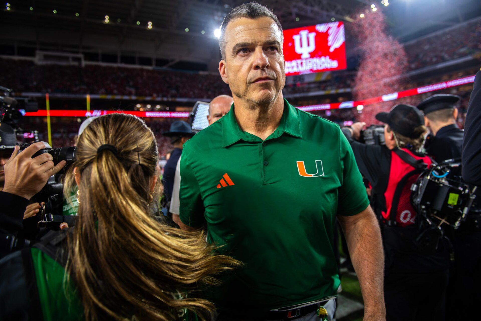 Miami Head Coach Mario Cristobal heads off the field after the College Football Playoff National Championship college football game at Hard Rock Stadium in Miami Gardens on Monday, Jan. 19, 2026.
