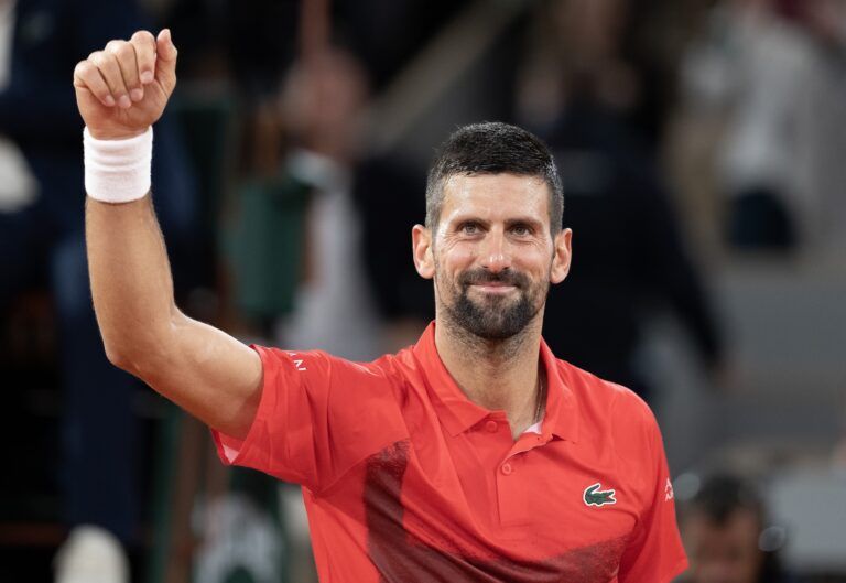 Novak Djokovic of Serbia celebrates winning his match against Mackenzie Mcdonald of the United States  on day three at Roland Garros Stadium.
