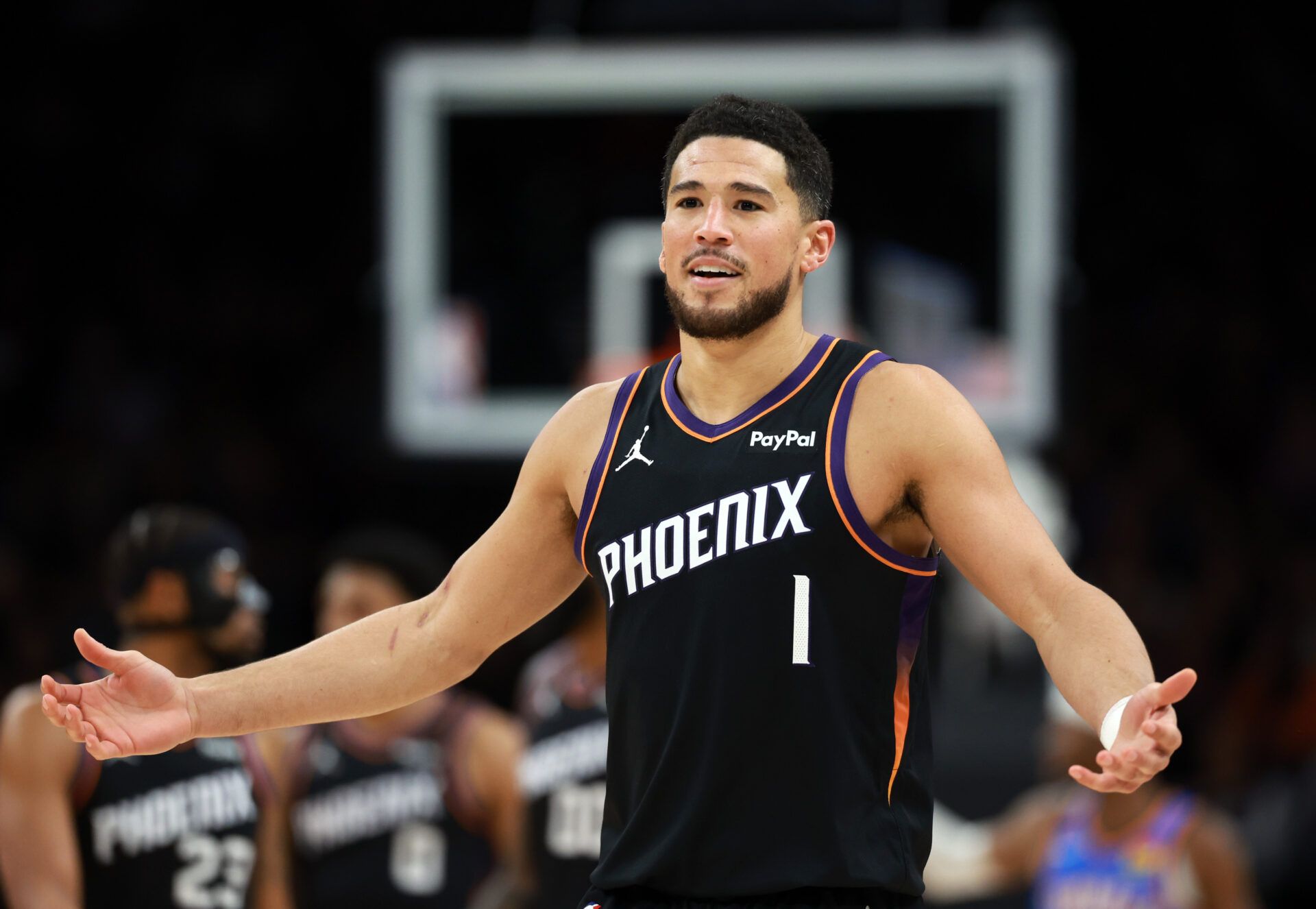 Phoenix Suns guard Devin Booker (1) reacts against the Oklahoma City Thunder at Mortgage Matchup Center.