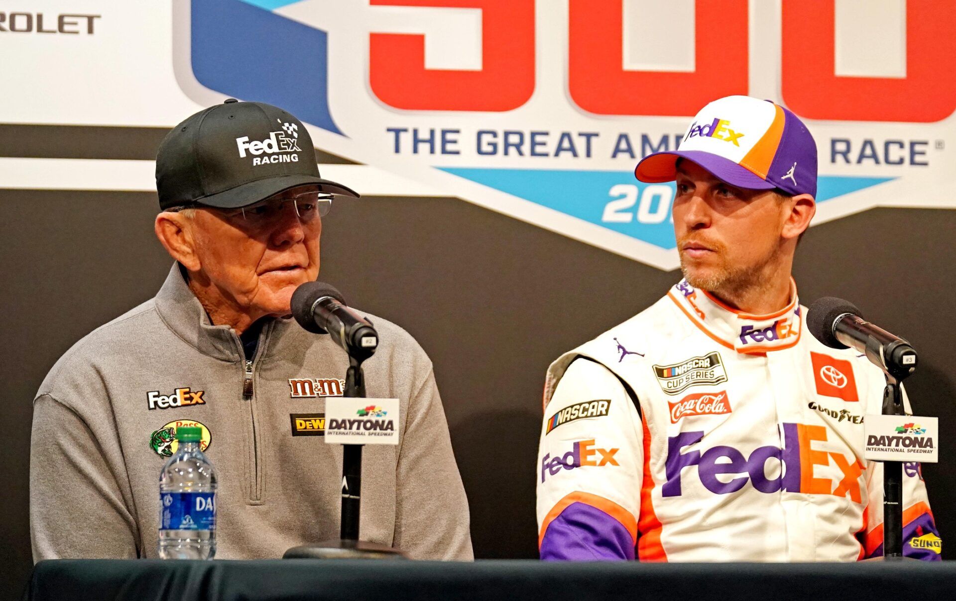 NASCAR Cup Series driver Denny Hamlin (11) speaks to media with team owner Joe Gibbs (left) after the Daytona 500 at Daytona International Speedway.
