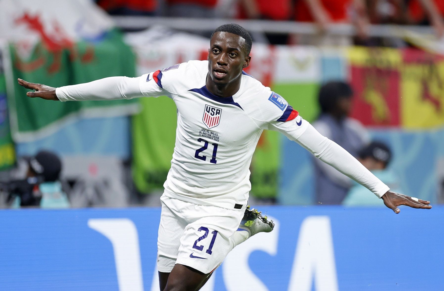 United States of America forward Timothy Weah (21) reacts after scoring a goal against Wales during the first half during a group stage match during the 2022 FIFA World Cup at Ahmed Bin Ali Stadium.