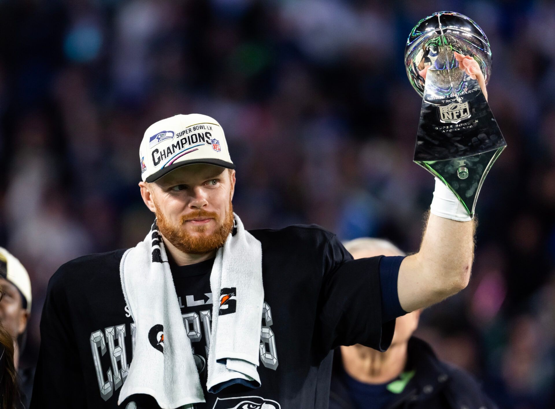 Seattle Seahawks quarterback Sam Darnold (14) celebrates with the Vince Lombardi Trophy after defeating the New England Patriots during Super Bowl LX at Levi's Stadium.