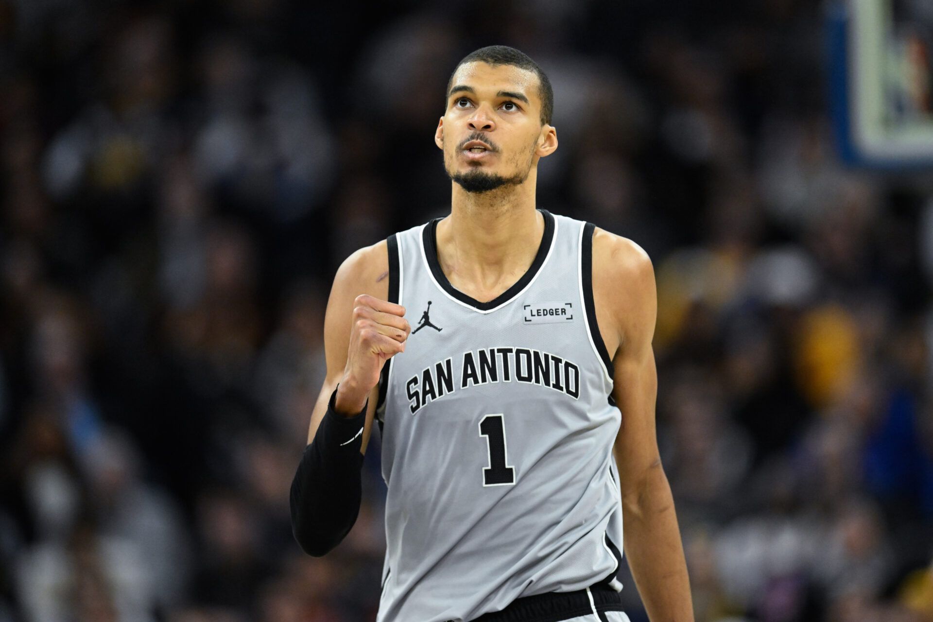 San Antonio Spurs forward Victor Wembanyama (1) celebrates a three-point basket against the Golden State Warriors in the fourth quarter at Chase Center.
