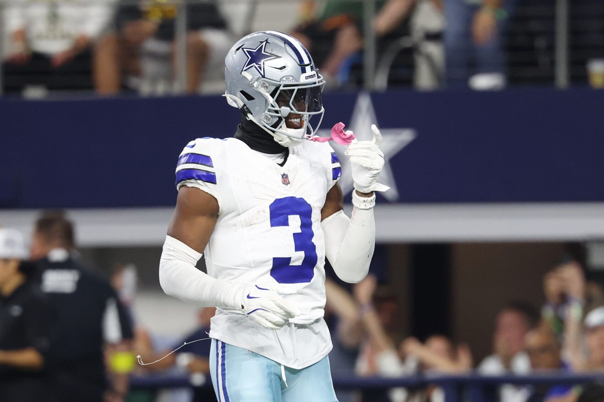Dallas Cowboys wide receiver George Pickens (3) celebrates after scoring a touchdown in the fourth quarter against the Green Bay Packers at AT&T Stadium.
