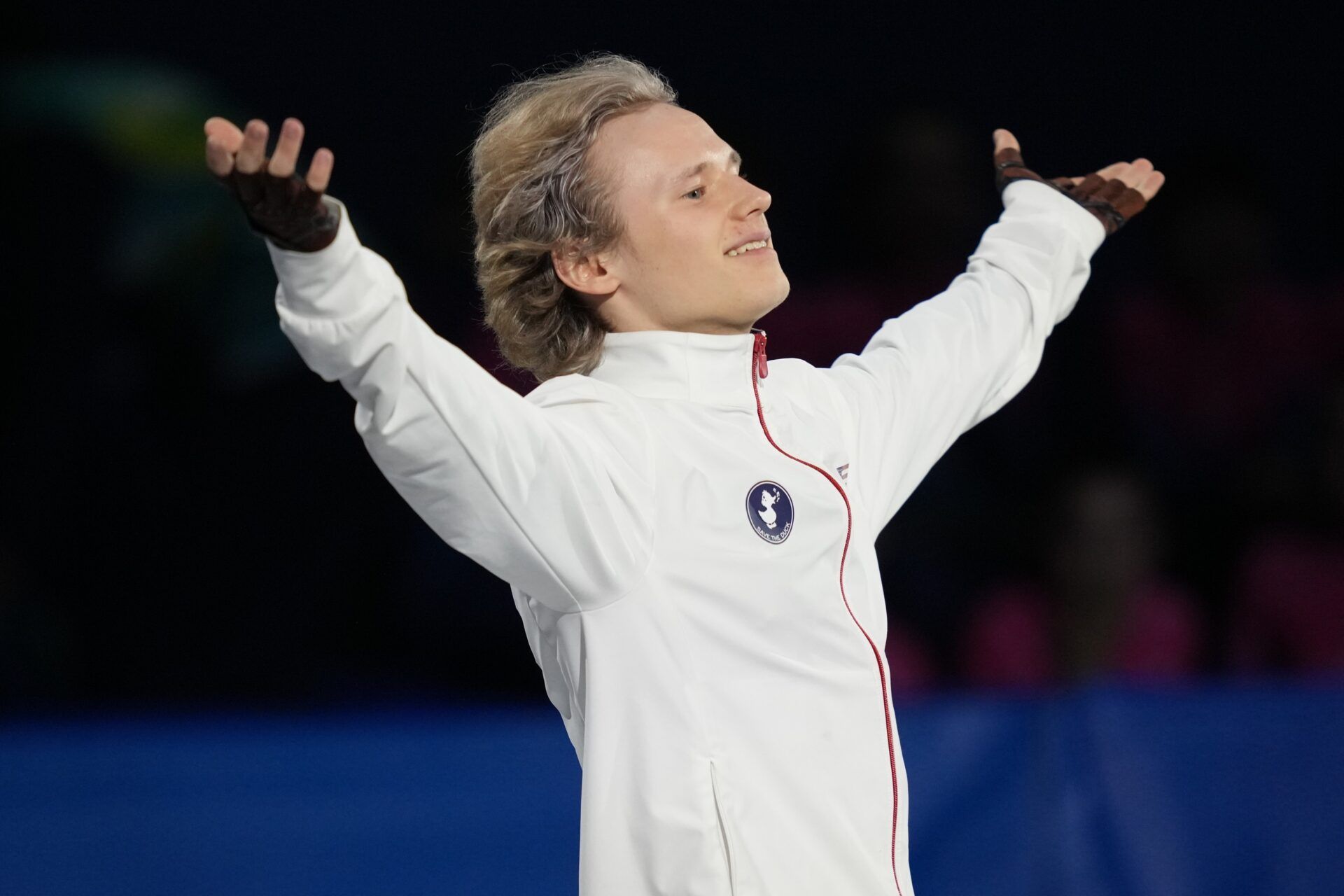 Ilia Malinin of the United States of America acknowledges the crowd as he warms up before men's singles short program during the Milano Cortina 2026 Olympic Winter Games at Milano Ice Skating Arena.