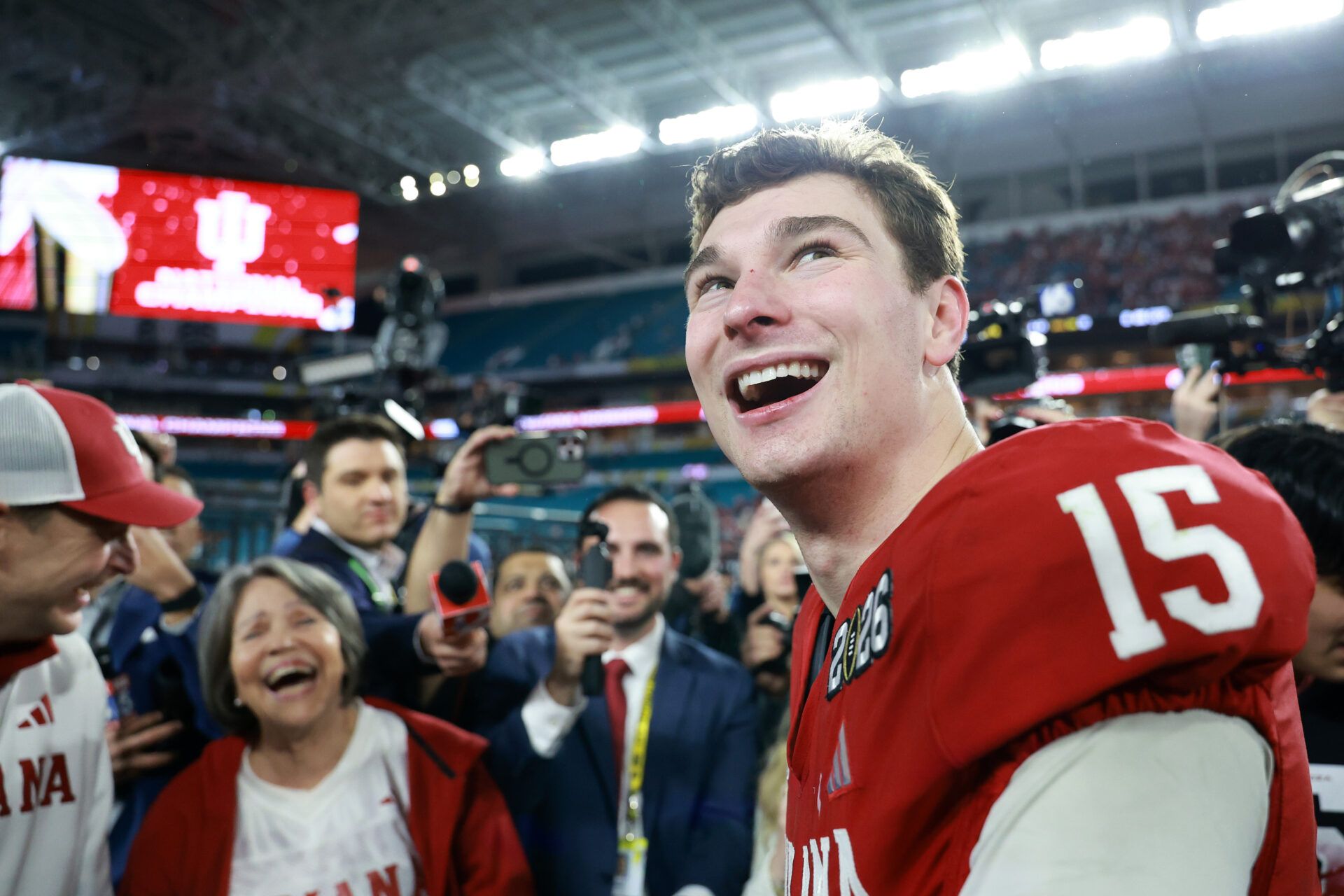 Indiana Hoosiers quarterback Fernando Mendoza (15) races after the College Football Playoff National Championship game against the Miami Hurricanes at Hard Rock Stadium.