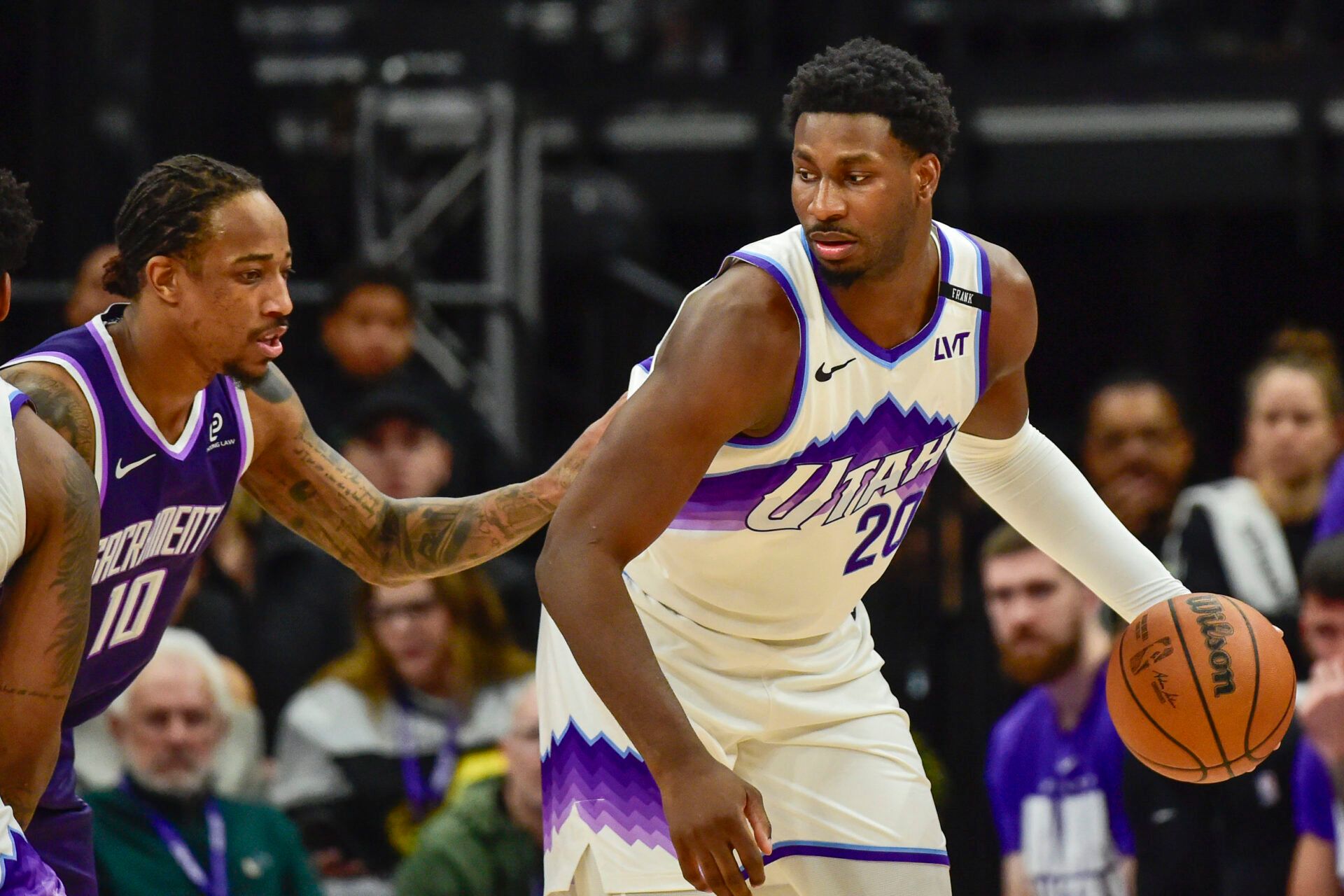 Utah Jazz forward Jaren Jackson Jr. (20) plans his next move around Sacramento Kings guard/forward DeMar DeRozan (10) during the first half at Delta Center.