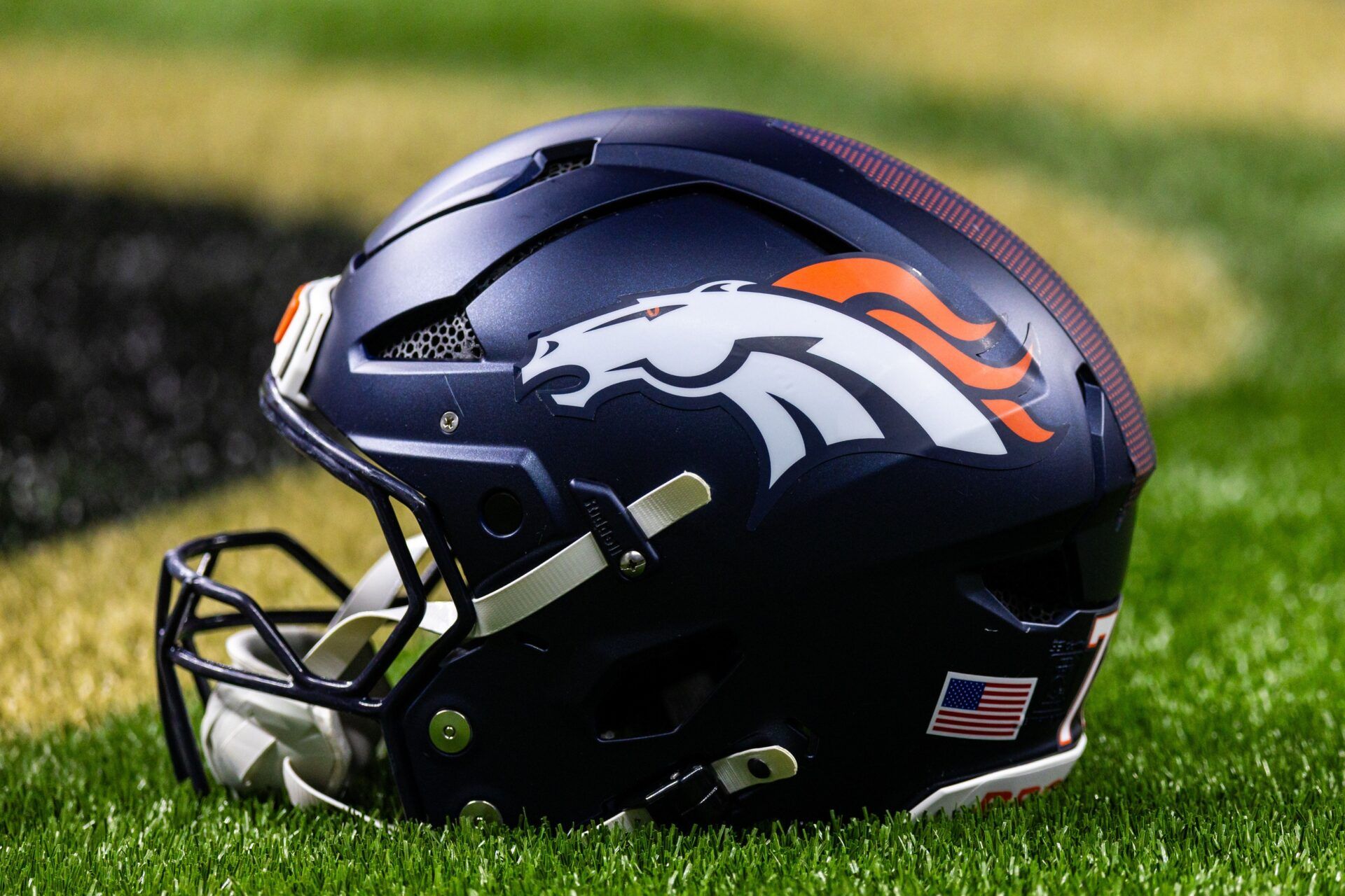 Detailed view of the Denver Broncos helmet against the New Orleans Saints during warmups at Caesars Superdome.