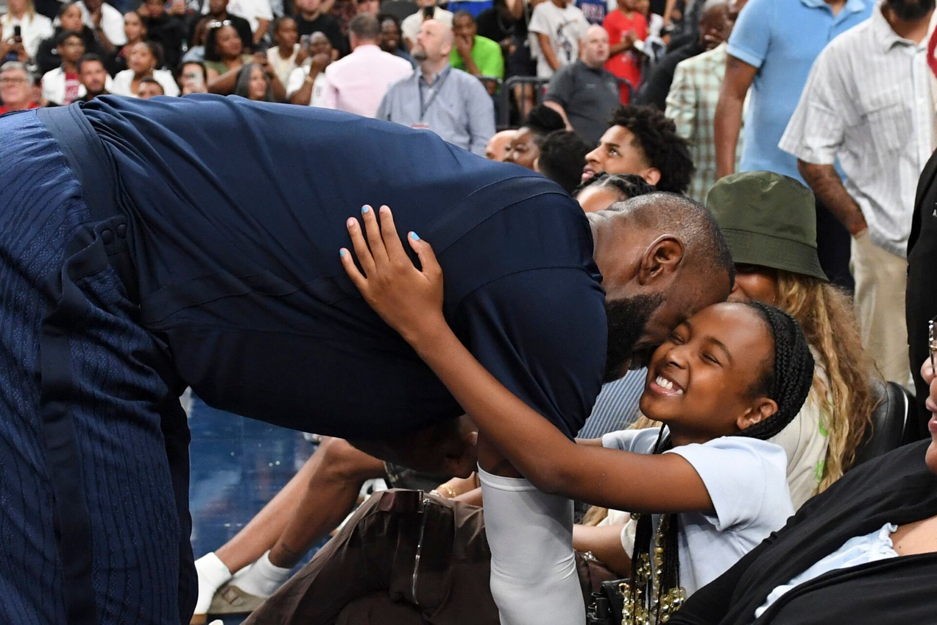 USA forward Lebron James (6) greets his daughter Zhuri James after the third quarter against Canada for the USA Basketball Showcase at T-Mobile Arena.