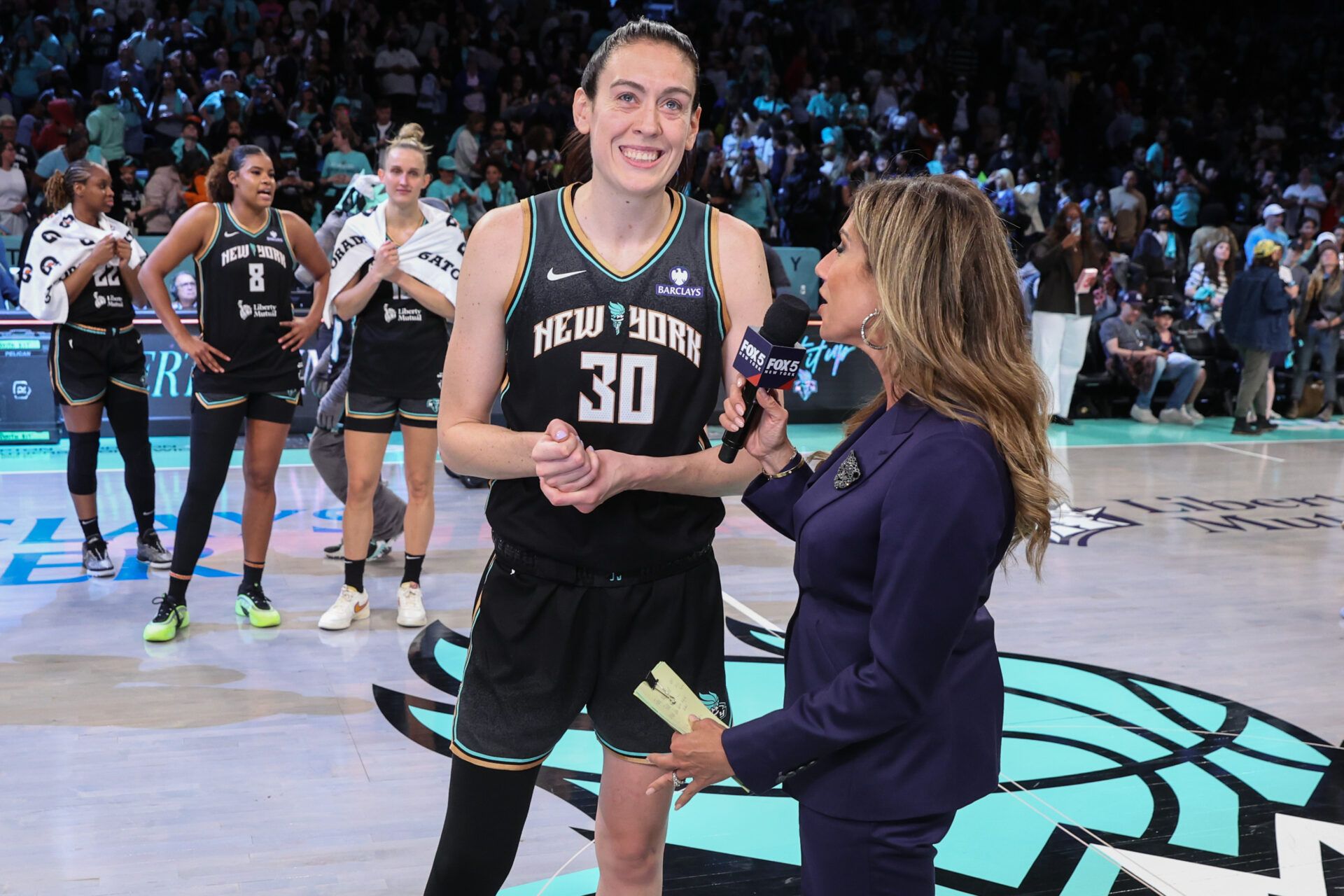 New York Liberty forward Breanna Stewart (30) and sports reporter Tina Cervasio at Barclays Center.