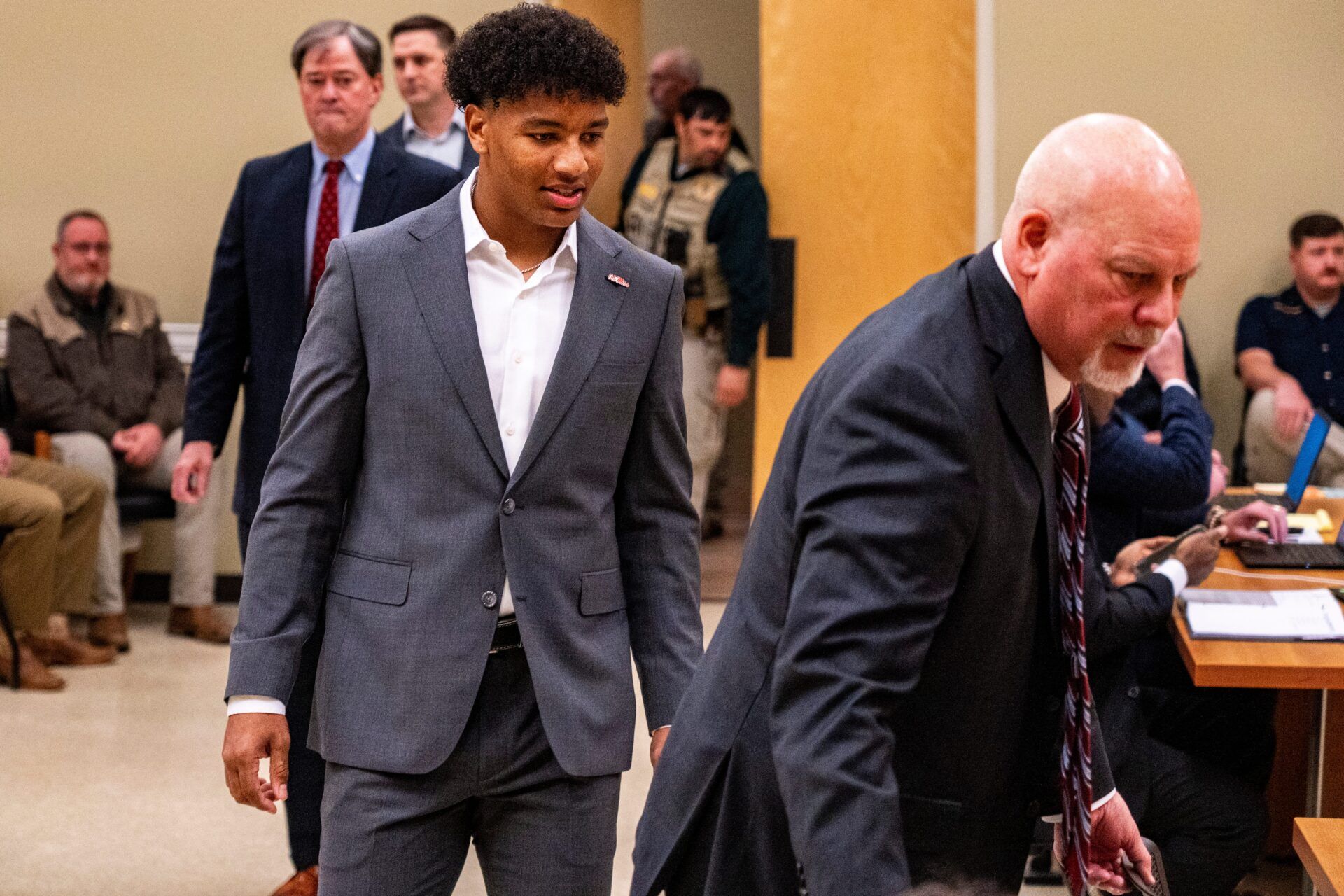 Ole Miss quarterback Trinidad Chambliss enters the courtroom during his lawsuit against the NCAA at Calhoun County Courthouse in Pittsboro, Miss., on Thursday, Feb. 12, 2026. Chambliss is looking for a temporary injunction and a permanent injunction against the NCAA for one more year of eligibility.