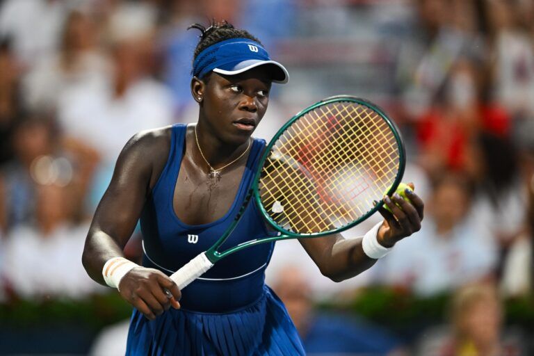 Victoria Mboko (CAN) gets ready to serve the ball against Naomi Osaka (JPN) during singles final play at IGA Stadium.