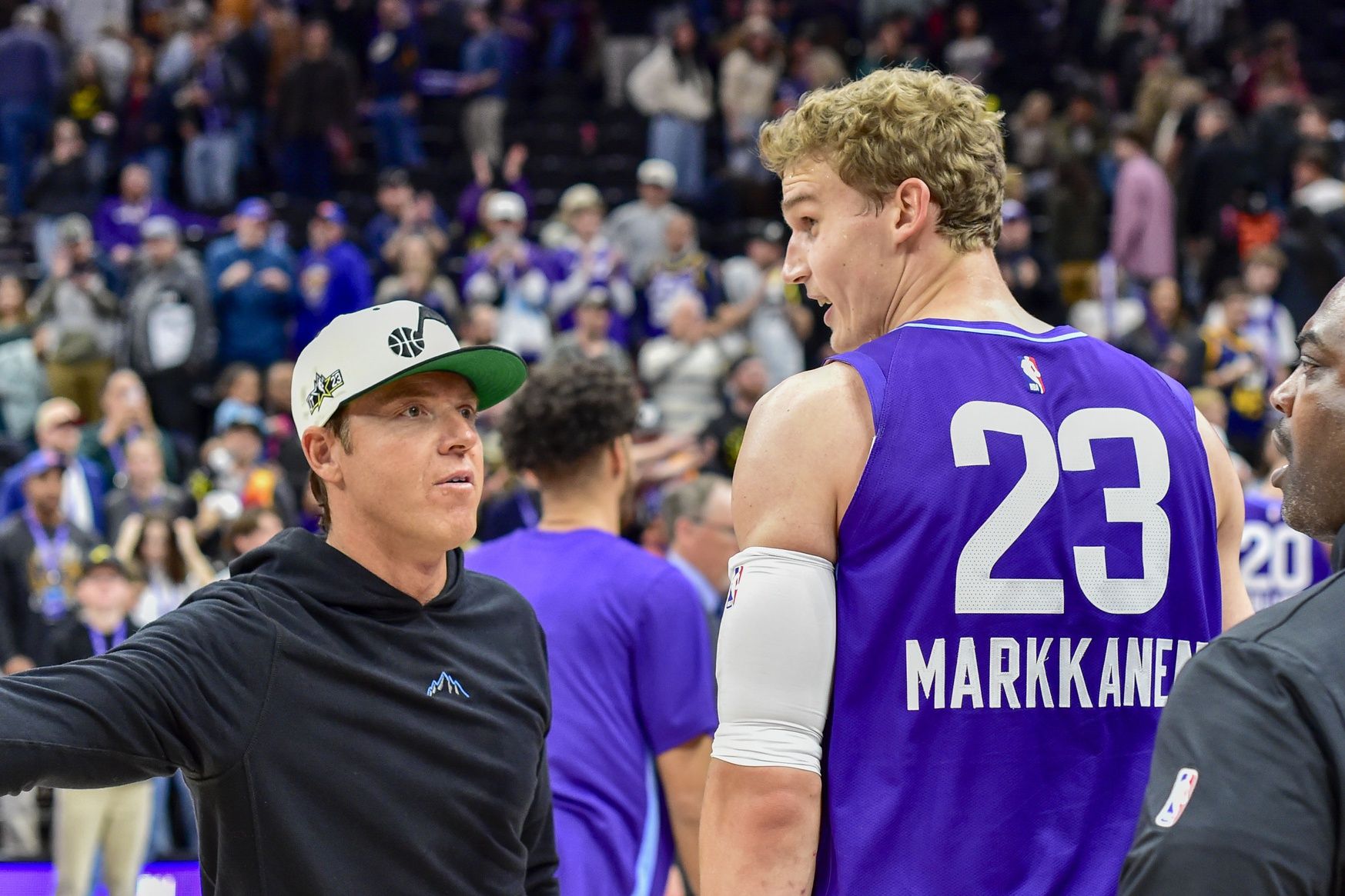 Utah Jazz forward/center Lauri Markkanen (23) and Ryan Smith after a game against the New York Knicks at the Delta Center.