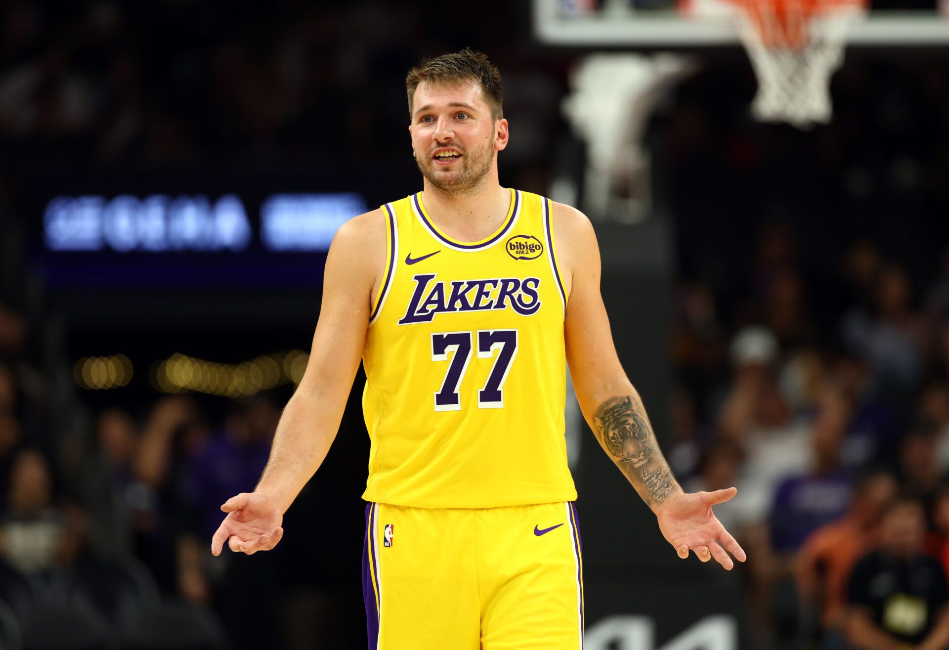 Los Angeles Lakers guard Luka Doncic (77) against the Phoenix Suns during an NBA preseason game at Mortgage Matchup Center.