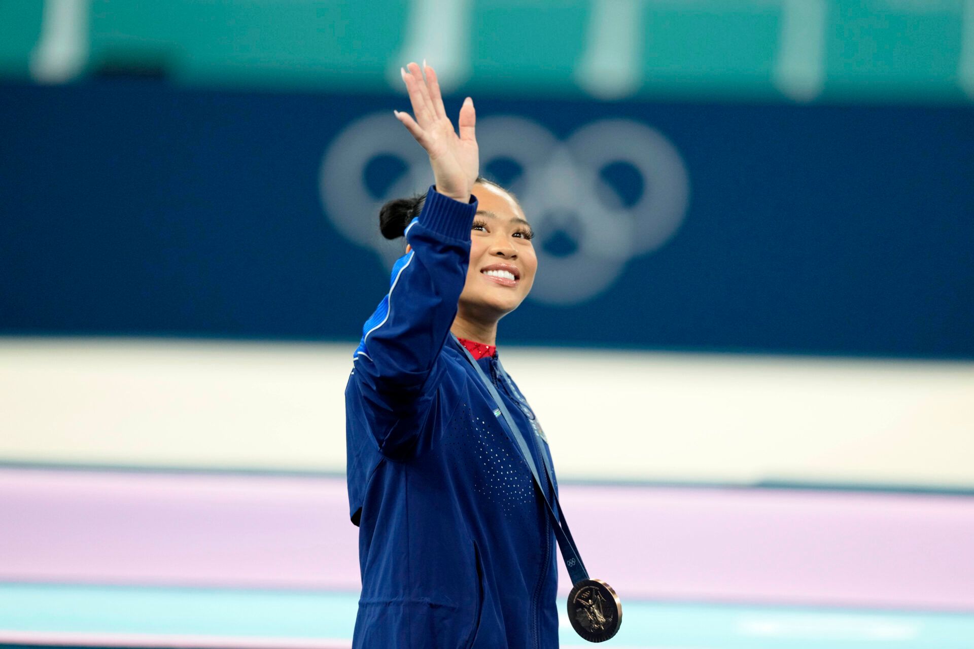 Sunisa Lee of the United States reacts after winning the bronze medal on uneven bars on the second day of gymnastics event finals during the Paris 2024 Olympic Summer Games at Bercy Arena.