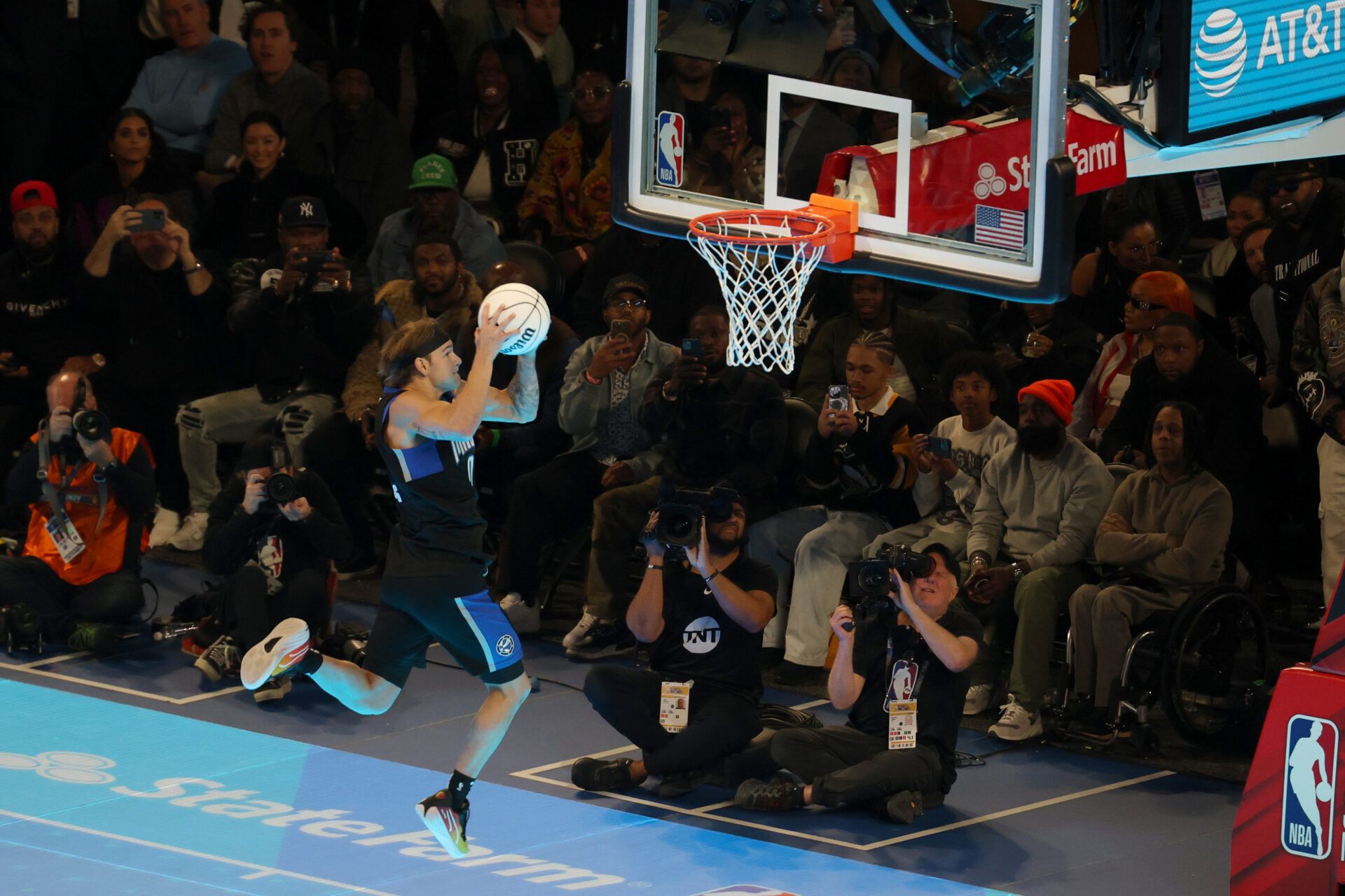 Osceola Magic guard Mac McClung (0) competes in the AT&T Slam Dunk Contest during NBA All Star Saturday Night at Lucas Oil Stadium.