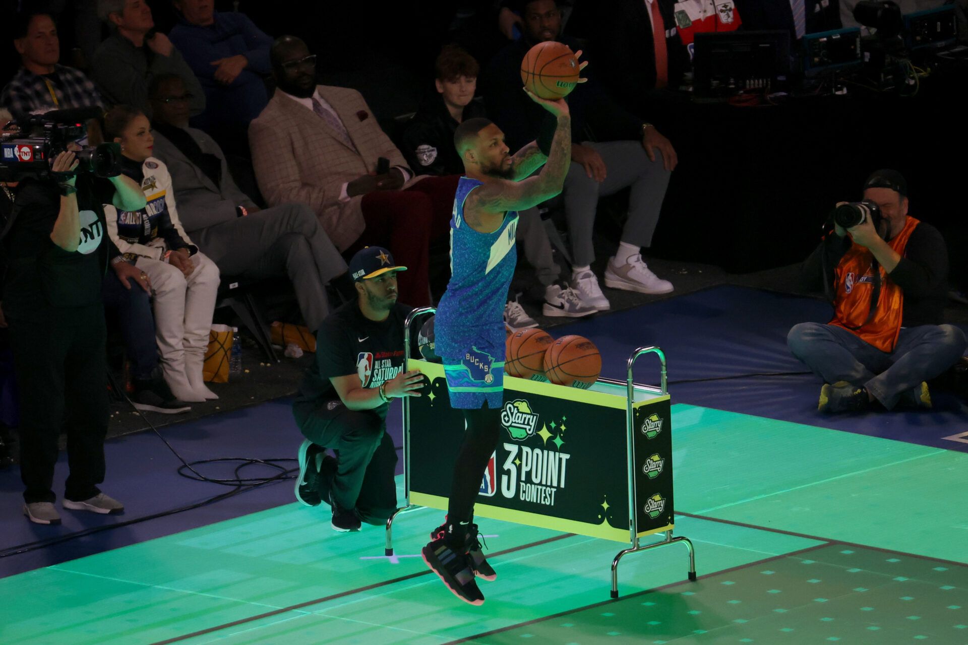 Milwaukee Bucks guard Damian Lilard (0) competes in the Starry 3-Point Contest during NBA All Star Saturday Night at Lucas Oil Stadium.