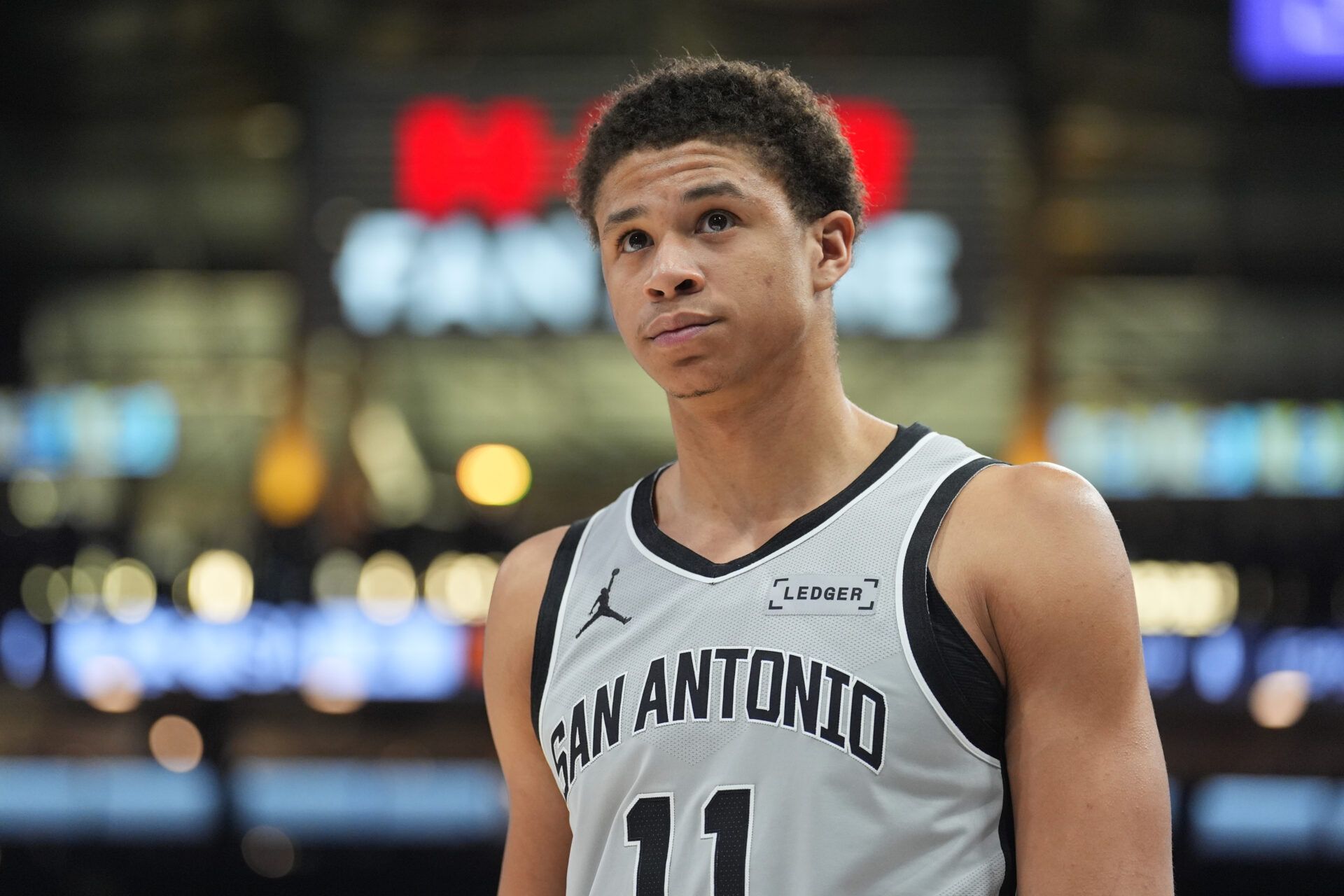 San Antonio Spurs forward Carter Bryant (11) looks up in the first half against the Dallas Mavericks at Frost Bank Center.