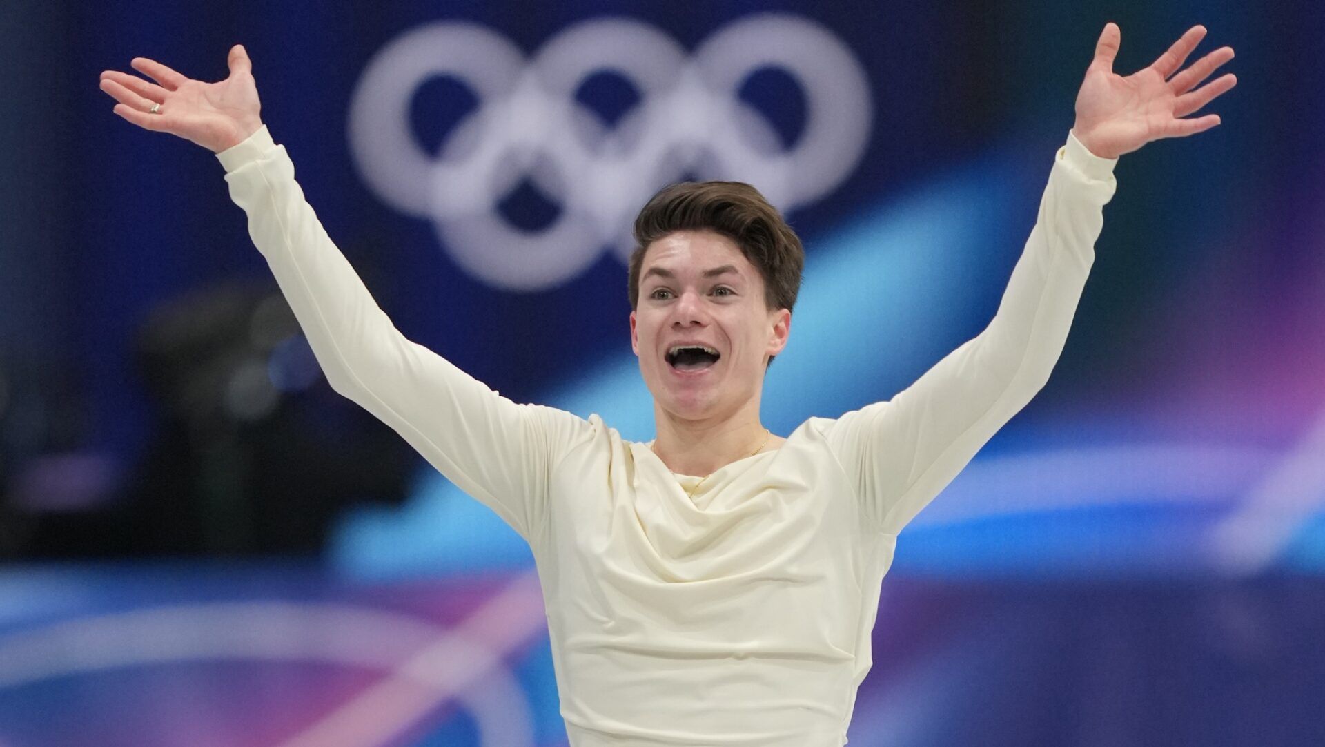 Maxim Naumov of the United States of America reacts after his performance in men's singles short program during the Milano Cortina 2026 Olympic Winter Games at Milano Ice Skating Arena.