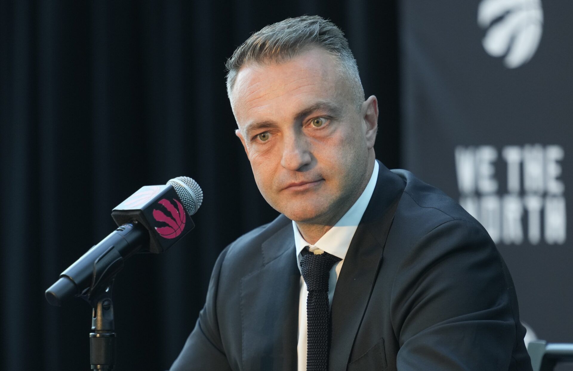 Toronto Raptors head coach Darko Rajakovic listens to a question from a reporter during the media day press conference at Hotel X.